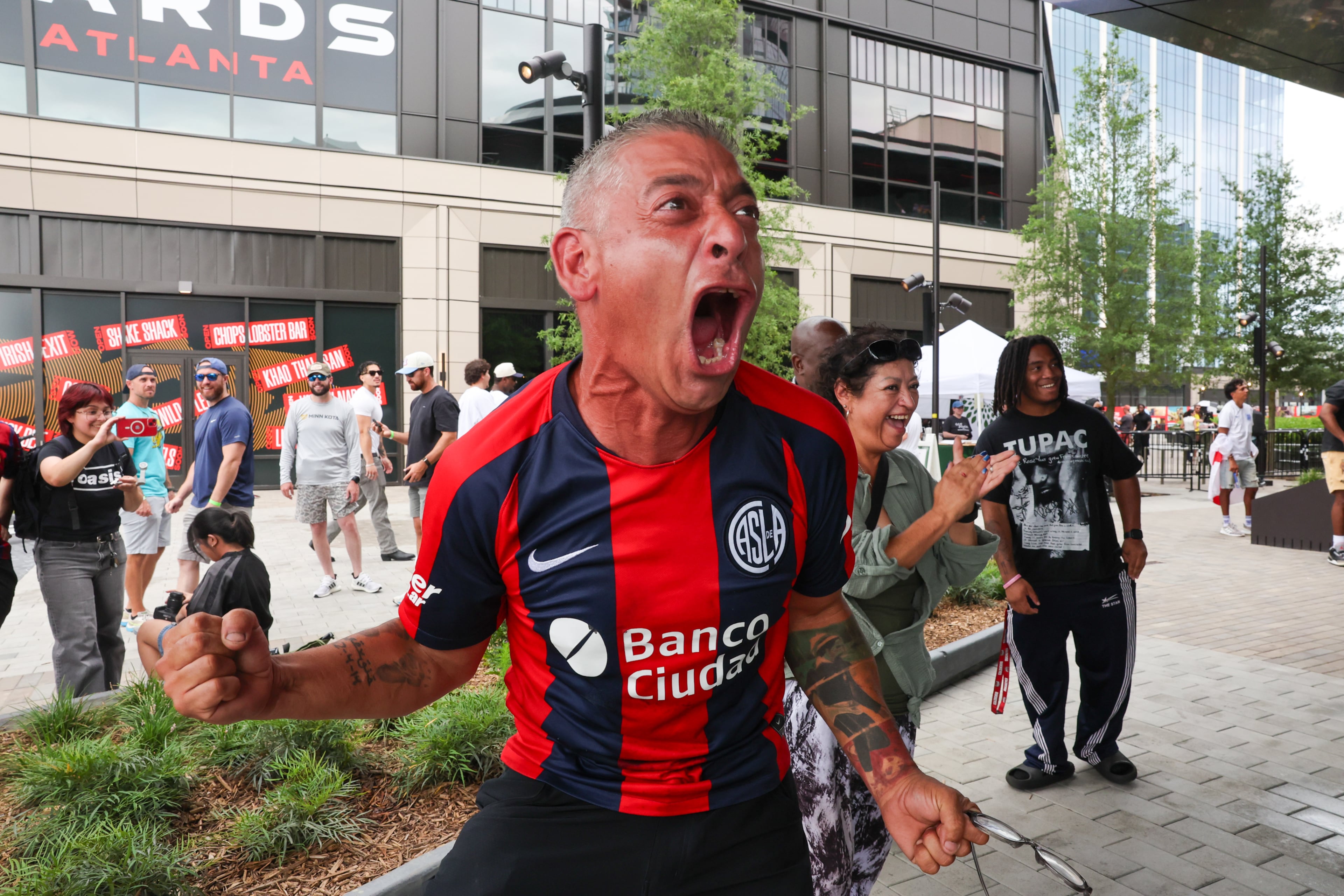 Edgar Nunez reacts while watching from outside a venue screening the game after Argentina scores a goal during the FIFA World Cup game between England and Argentina in Atlanta on July 15, 2026. It’s the last game Atlanta is hosting. Argentina won 2-1. (Arvin Temkar/AJC)