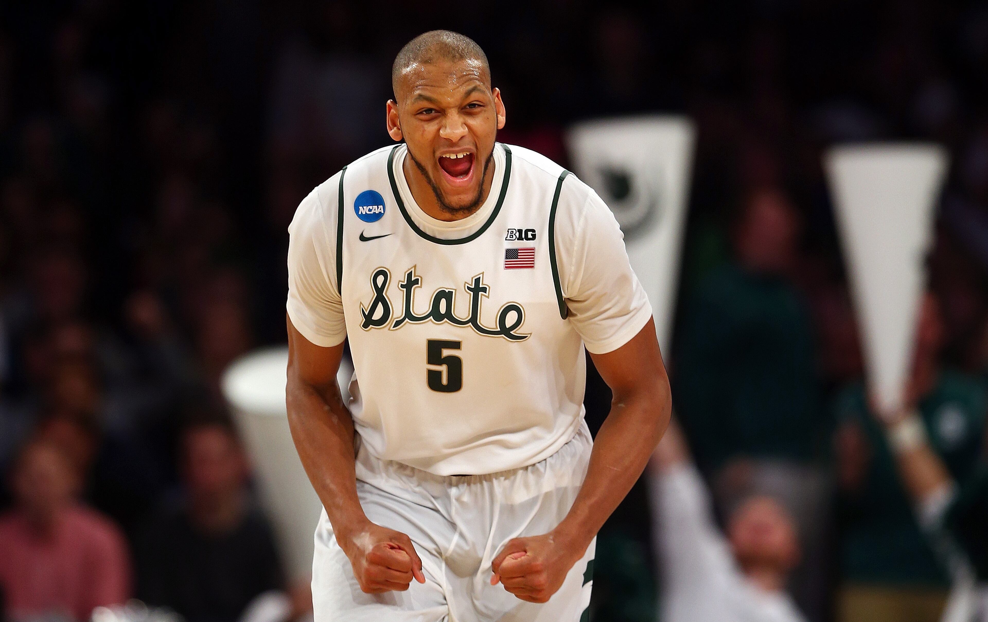 Adreian Payne #5 of the Michigan State Spartans reacts after a basket in the second half against the Connecticut Huskies during the East Regional Final of the 2014 NCAA Men's Basketball Tournament at Madison Square Garden on March 30, 2014 in New York City. (Photo by Elsa/Getty Images)