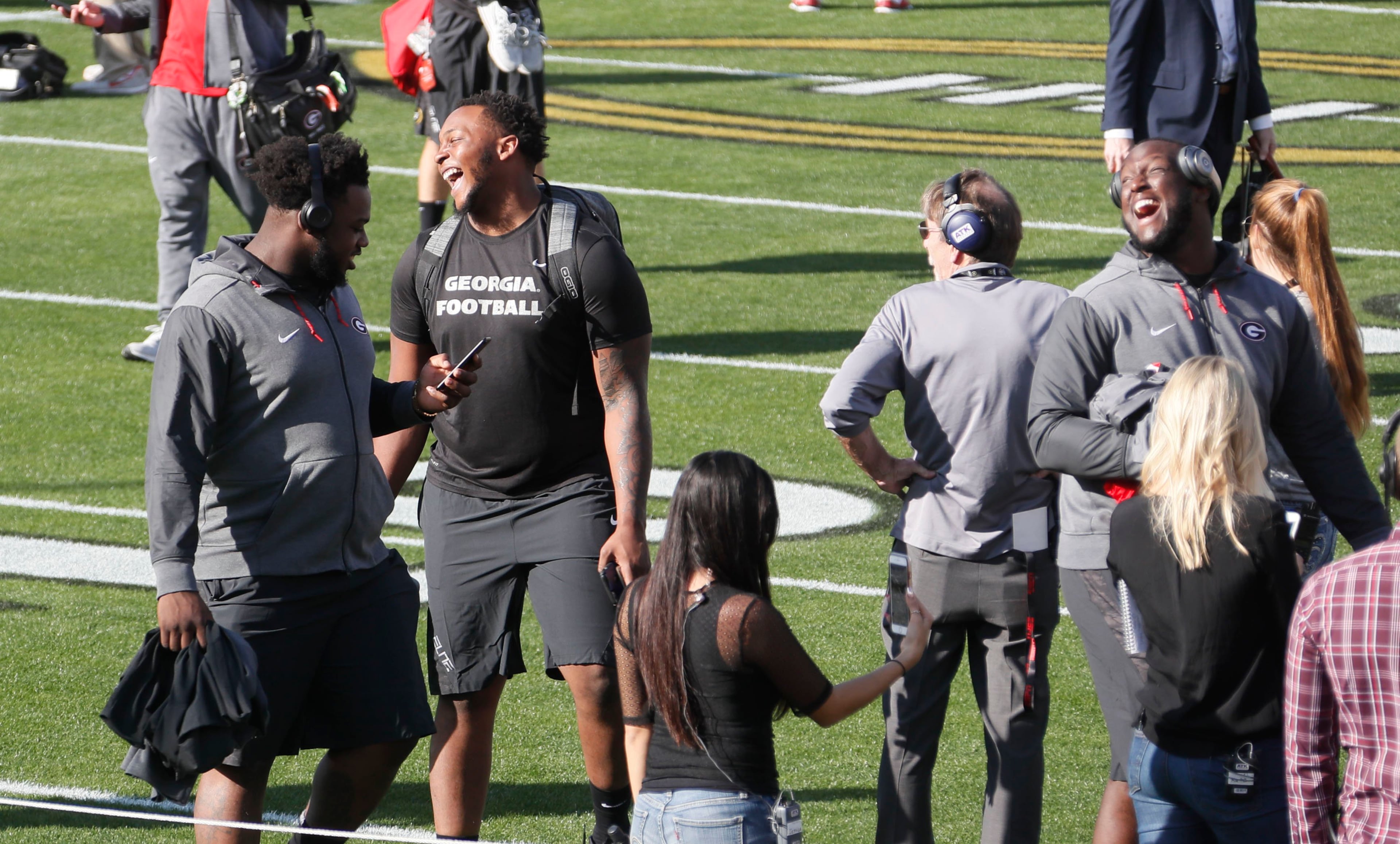 12/31/17 - Los Angeles - Georgia players appeared to be in good spirits as they visited the field after the team took an official team photo in front of the stadium. Fans turned out at the Rose Bowl as both Georgia and Oklahoma arrived to take team photos. Georgia plays Oklahoma in a NCAA football playoff game on Monday at Spieker Field, and a victory there, will put the Bulldogs in Mercedes-Benz Stadium on Jan. 8 to play one of two rivals -- Alabama or Clemson -- for the national title. AJC Photo