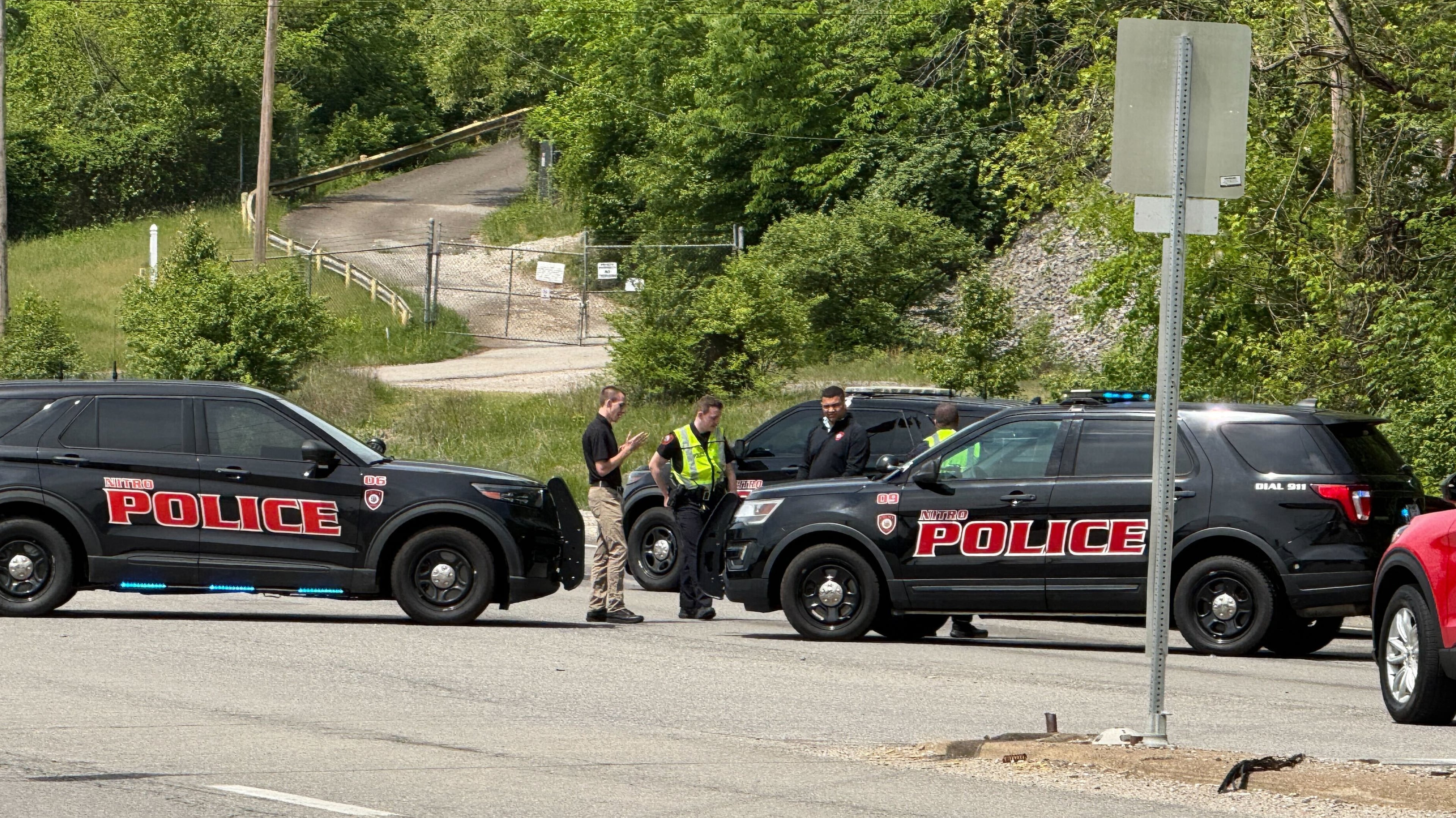 Police block a road near a chemical plant where a leak occurred Wednesday, April 22, 2026, in Institute, W.Va. (AP Photo/John Raby)