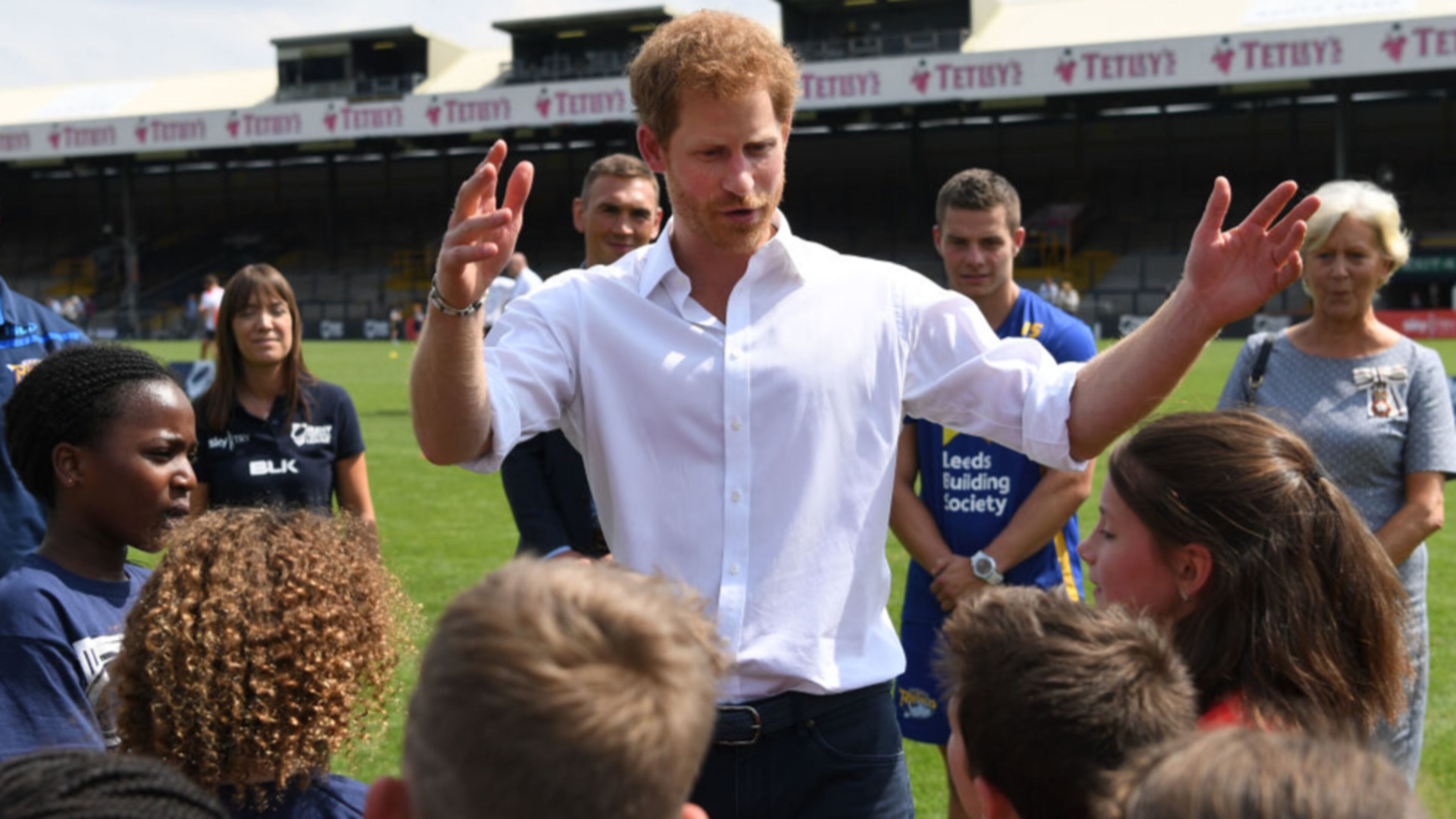 Britain's Prince Harry meets schoolchildren during his visit to the Headingley Carnegie Stadium on Thursday.