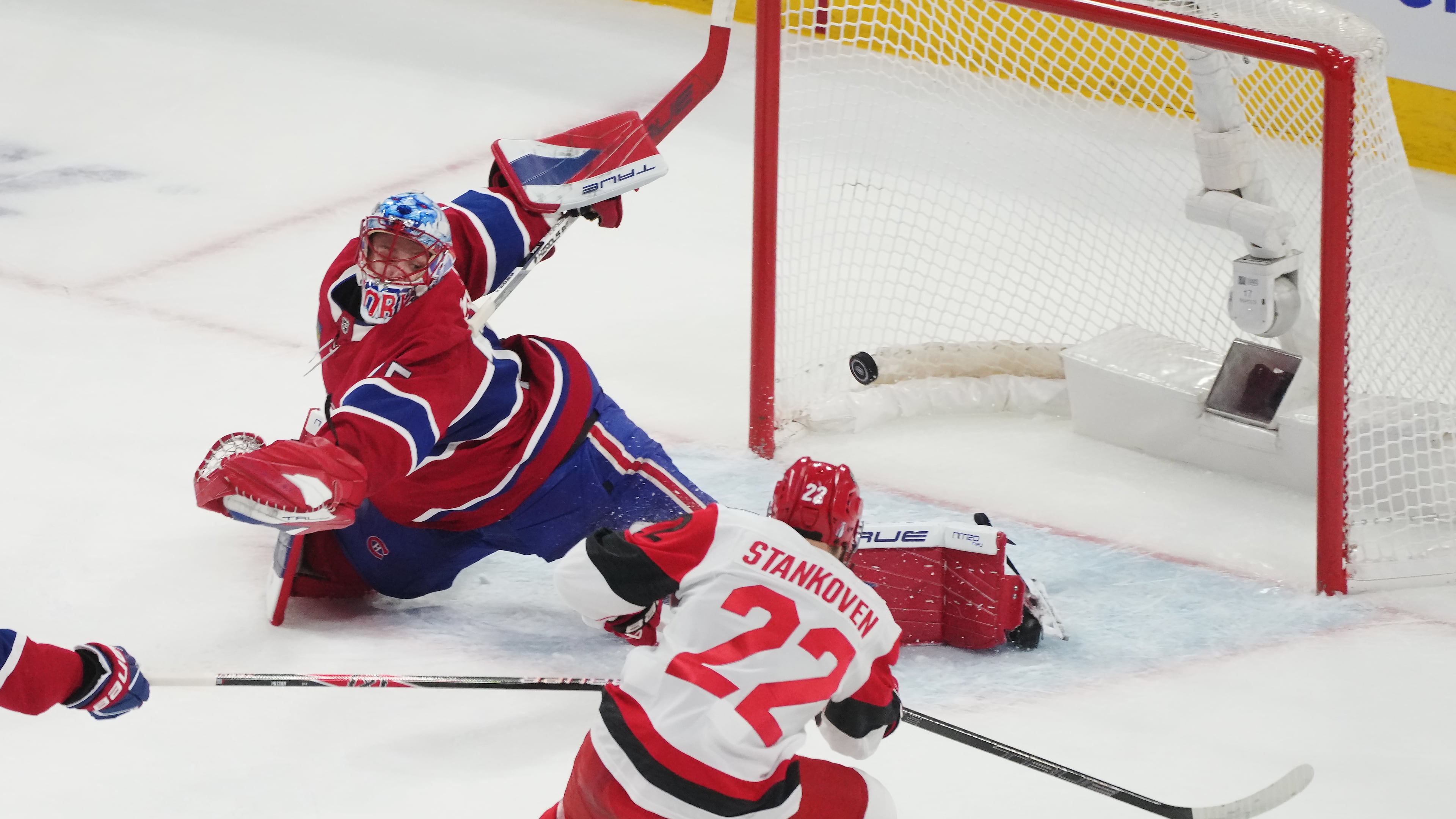 Carolina Hurricanes' Logan Stankoven (22) scores on Montreal Canadiens goaltender Jakub Dobes (75) during the first period of Game 4 of NHL Eastern Conference final Stanley Cup playoff series action in Montreal, Quebec, Wednesday, May 27, 2026. (Christinne Muschi/The Canadian Press via AP)