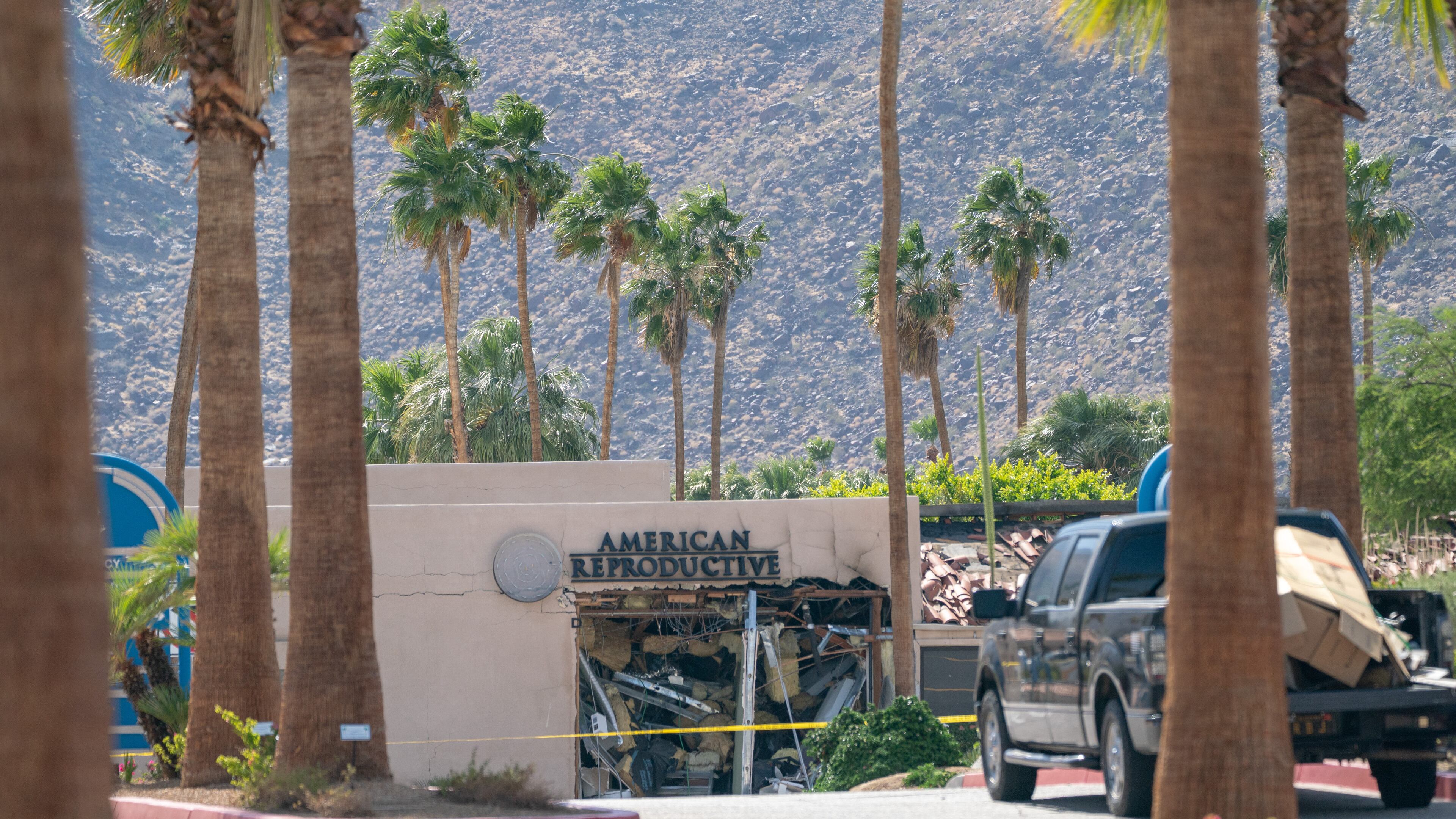 Caution tape surrounds the scene after an explosion at the American Reproductive Centers clinic in Palm Springs, Calif., on Saturday, May, 17, 2025. One person is dead after the bomb exploded, damaging buildings and leaving windows shattered in restaurants, shops and apartment buildings across several blocks in the city’s downtown. (Kyle Grillot/The New York Times)
