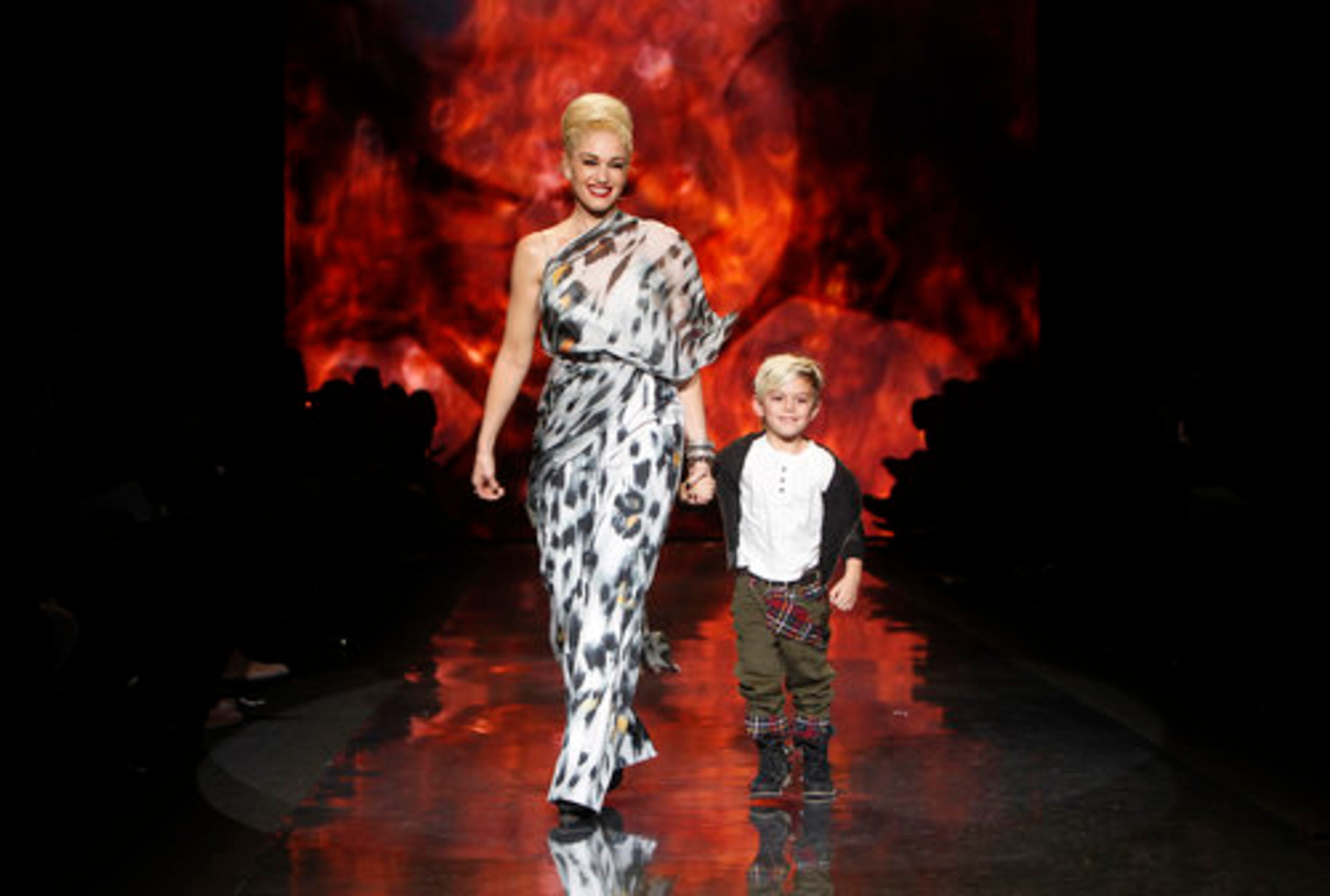 Designer Gwen Stefani walks the runway with her son, Kingston, after the L.A.M.B. fall 2011 collection show during Fashion Week Thursday, Feb. 17, 2011 in New York.