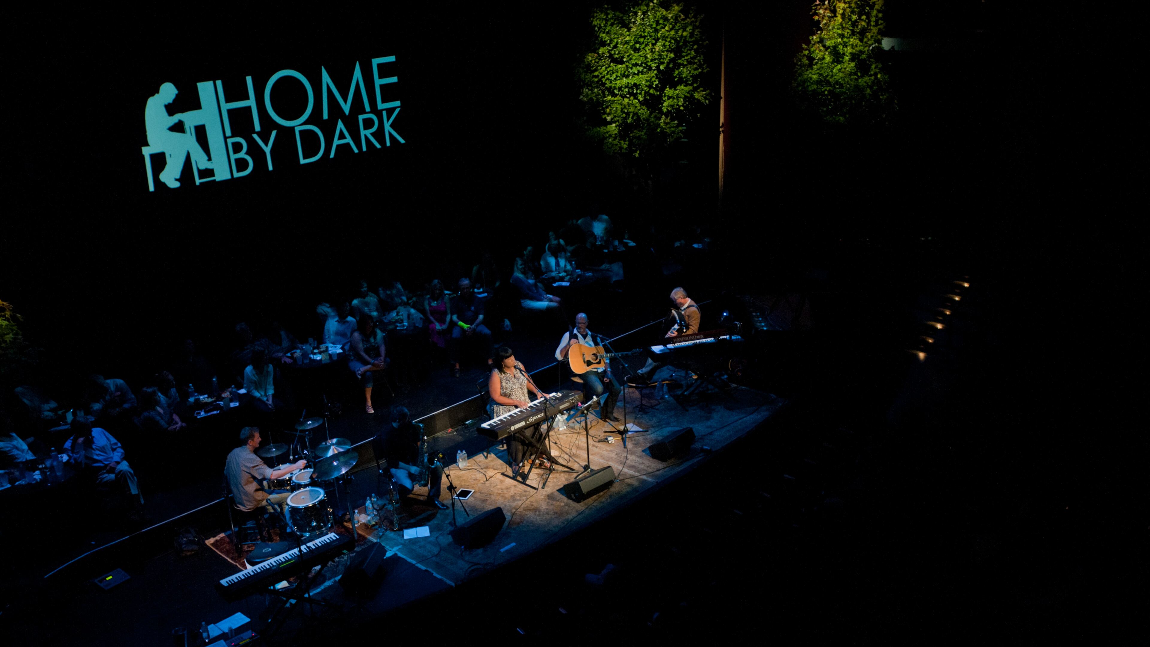 Home By Dark gathers songwriters and musicians for an evening of storytelling and music.