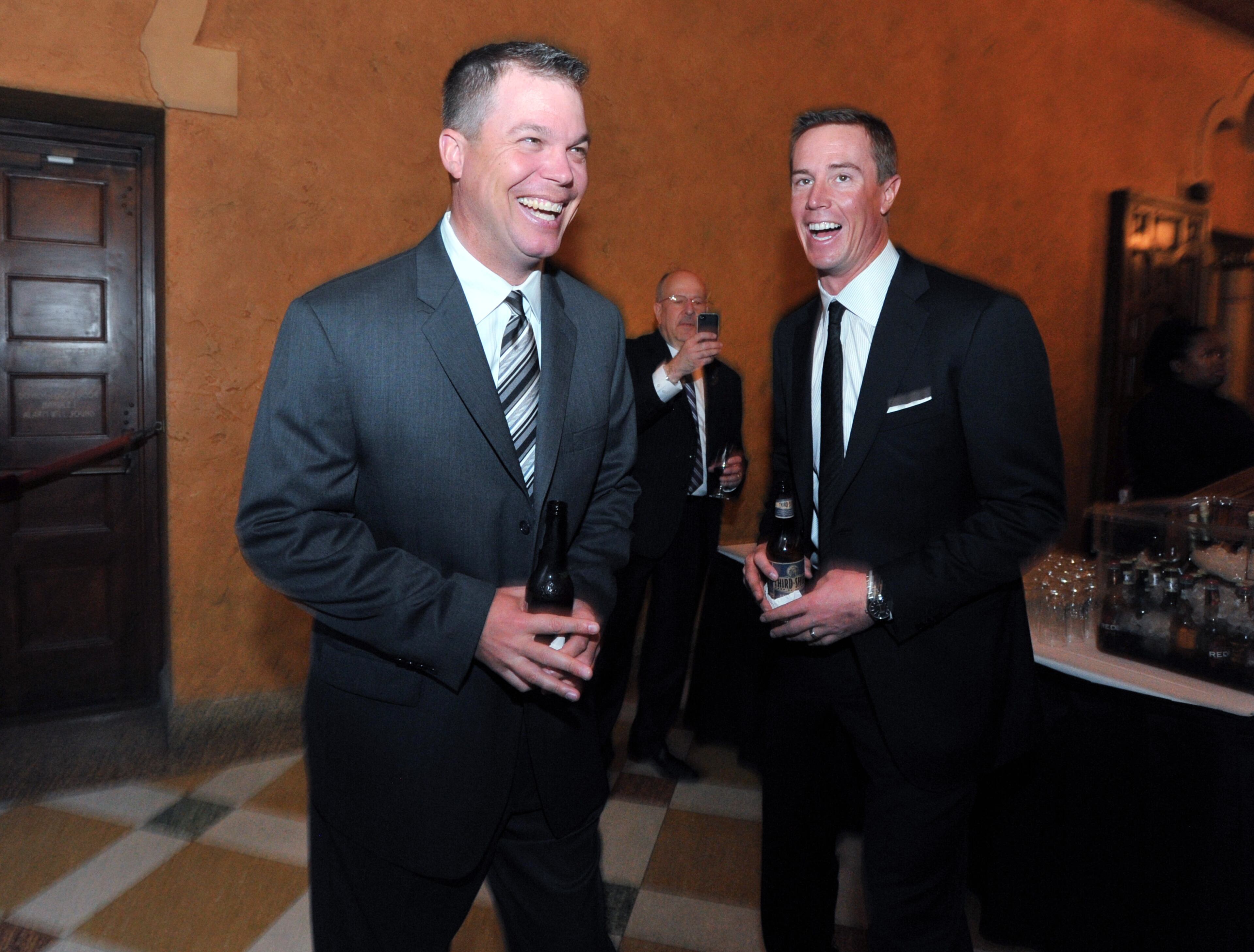 Former Atlanta Brave third baseman Chipper Jones (left) and Atlanta Falcons Matt Ryan share a laugh.