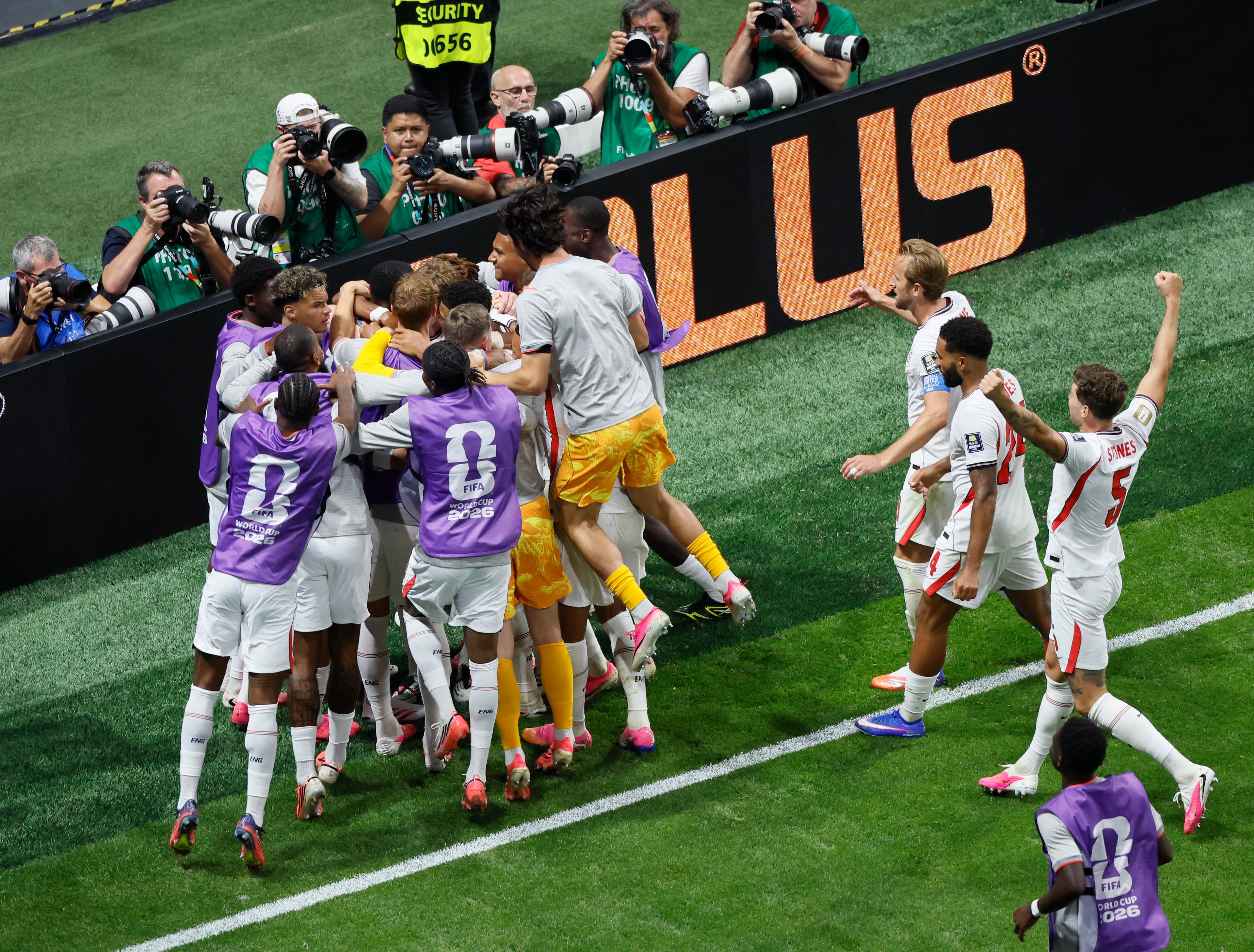 England's Anthony Gordon is mobbed by teammates after scoring goal during second half of Argentina vs. England FIFA World Cup Semifinal match at Atlanta Stadium (Mercedes-Benz Stadium) on Wednesday, July 15, 2026. (Miguel Martinez/AJC)