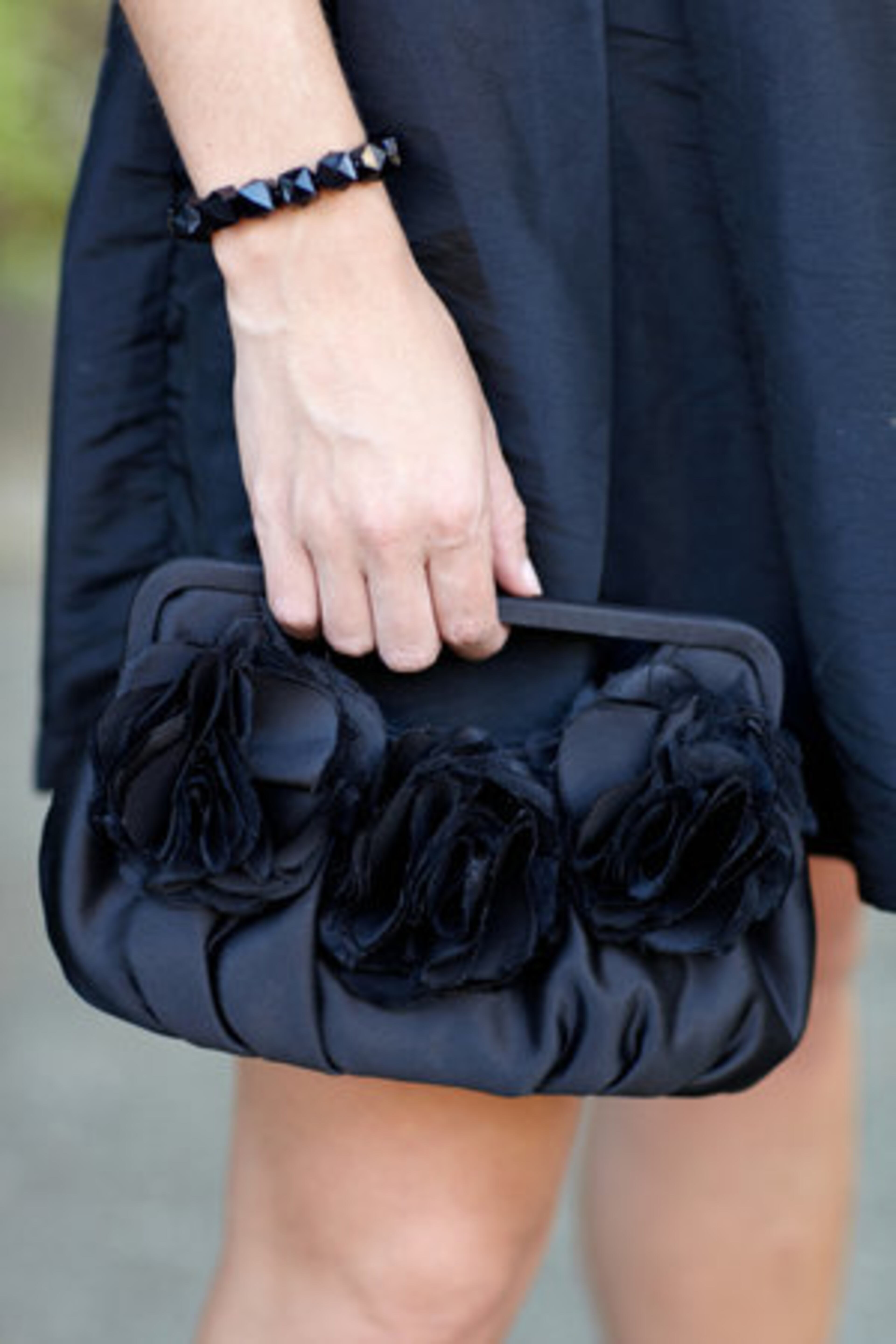 "I am looking forward to an incredible year, but most excited to be able to represent Georgia and Atlanta." Black shows off her flower detailed black clutch from Bebe.