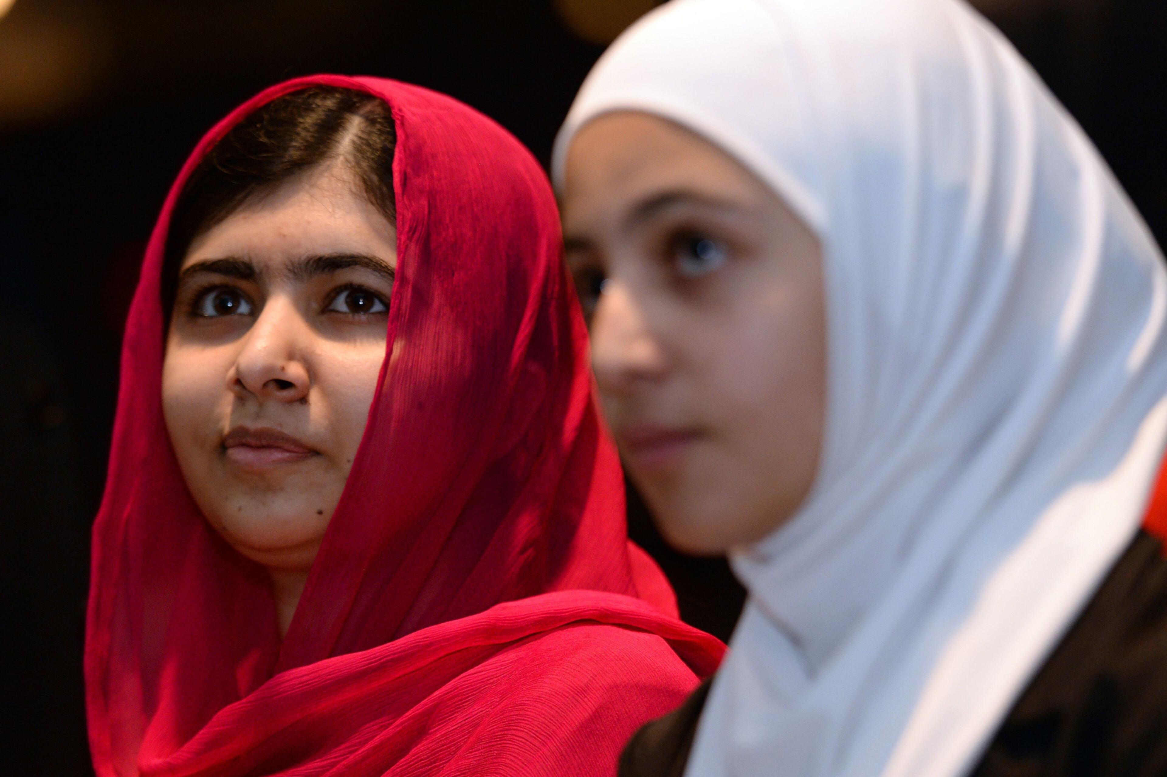 FOCUS ON EDUCATION--Nobel Peace Prize winner Malala Yousafzai, left, from Pakistan and 17-year-old Syrian refugee Mazoun Almellehan, during the first focus event on education at the 'Supporting Syria and the Region' conference at the Queen Elizabeth II Conference Centre in London, Thursday, Feb. 4, 2016. Leaders and diplomats from 70 countries are meeting in London Thursday to pledge billions to help millions of Syrians displaced by war, and try to slow the chaotic exodus of refugees to Europe. (Stefan Rousseau Pool via AP)