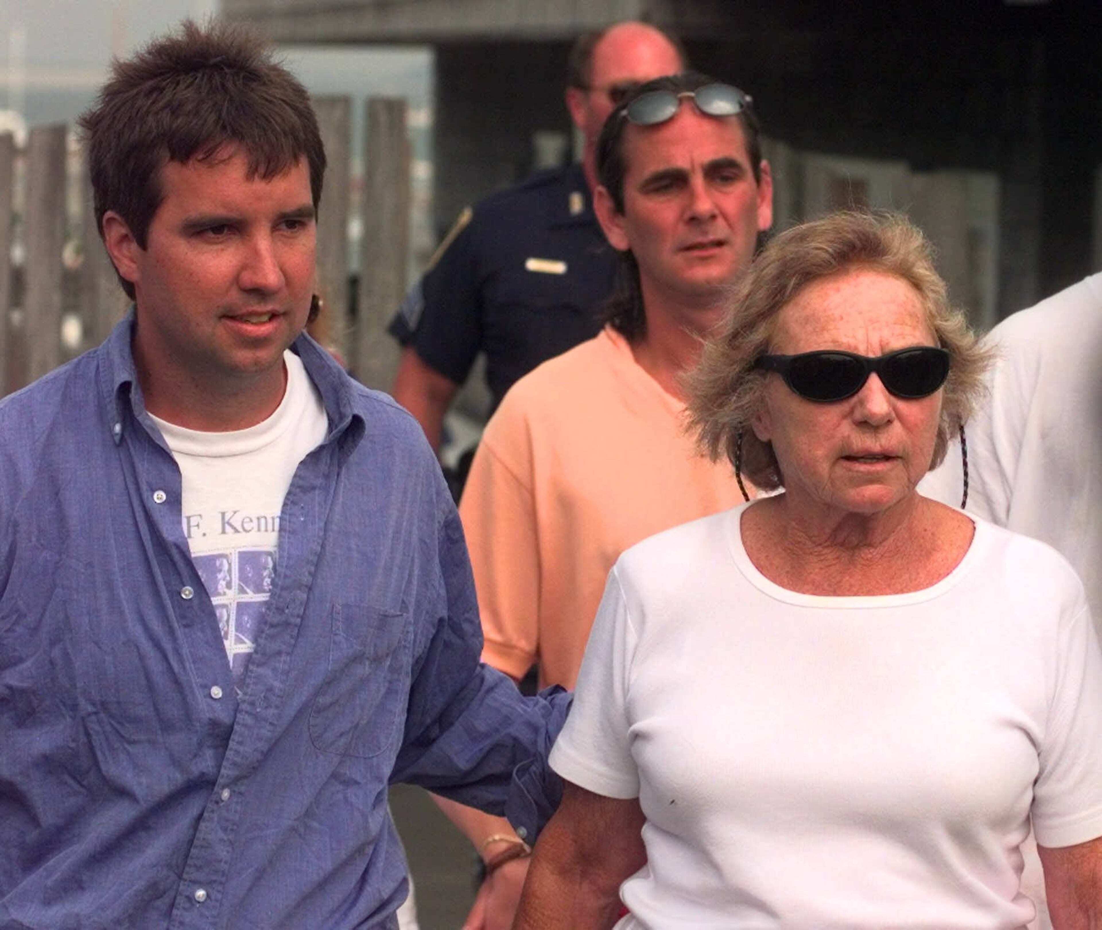Ethel Kennedy, right, walks with a family member after returning from an afternoon sail Monday, July 19, 1999 in Hyannis Port, Mass. Divers plunged into the Atlantic today and a high-tech vessel scoured the ocean floor for the wreckage of the plane that carried John F. Kennedy Jr., his wife and her sister, that went missing late Friday. (AP Photo/Chris Gardner)