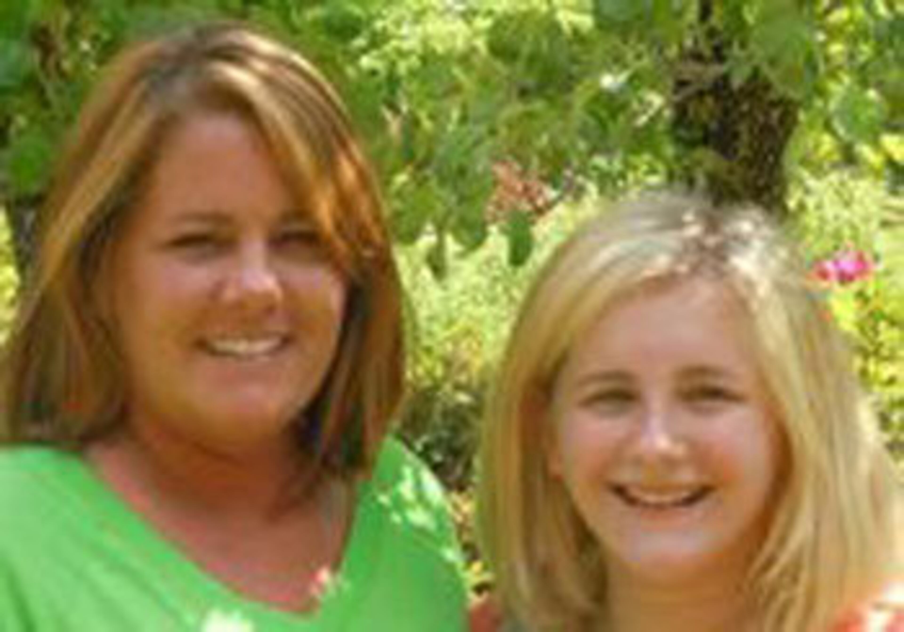 Kylie Peavy, shown here with her mother, Stacey Peavy, was blown out of her bedroom by the storm and found in a side yard by her mother. She had only minor injuries. They huddled in their house with other family members until the tornado passed.