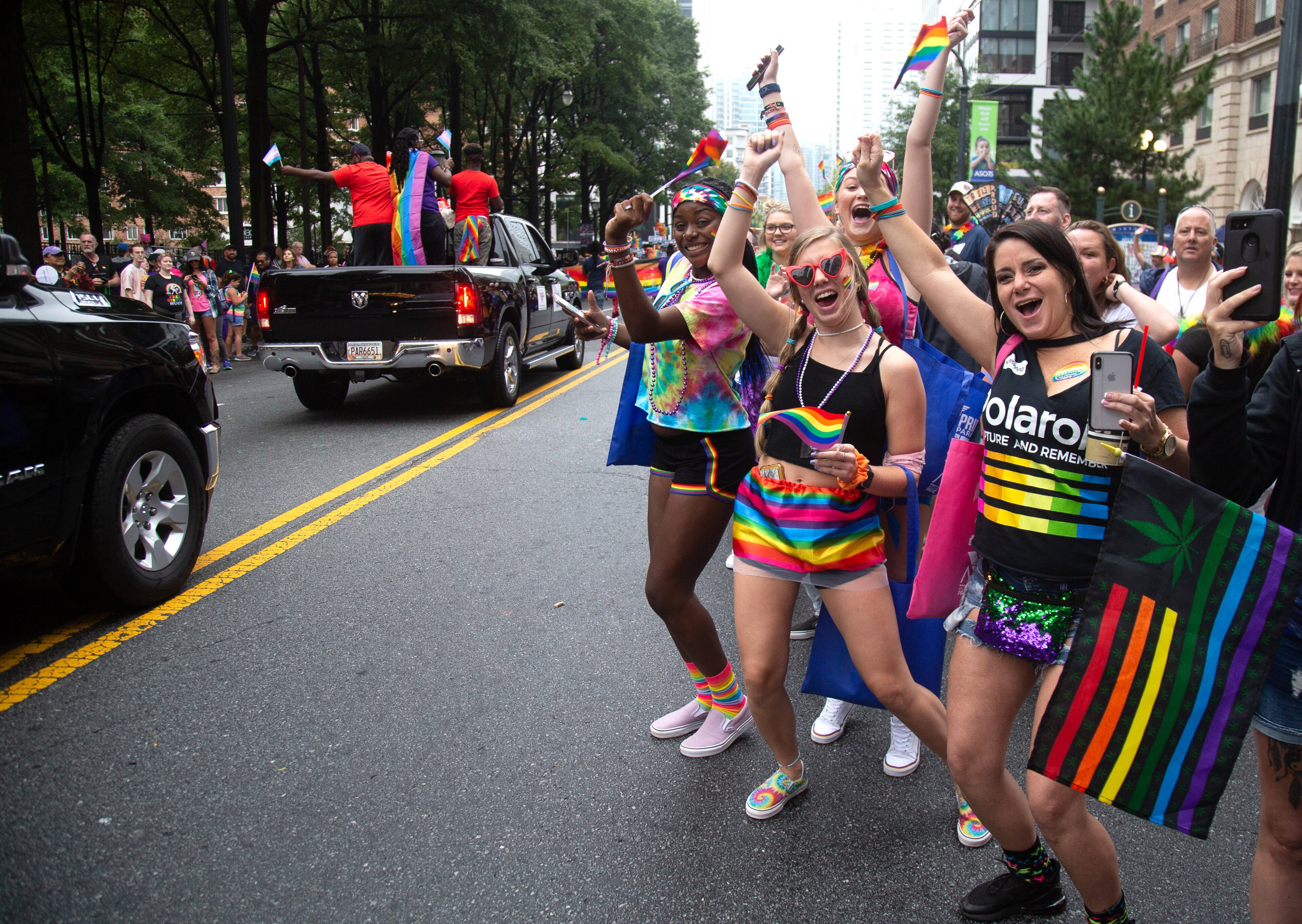 People cheer on the parade during the 49th annual Pride Festival and Parade in Atlanta Sunday, Oct. 13, 2019. STEVE SCHAEFER / SPECIAL TO THE AJC