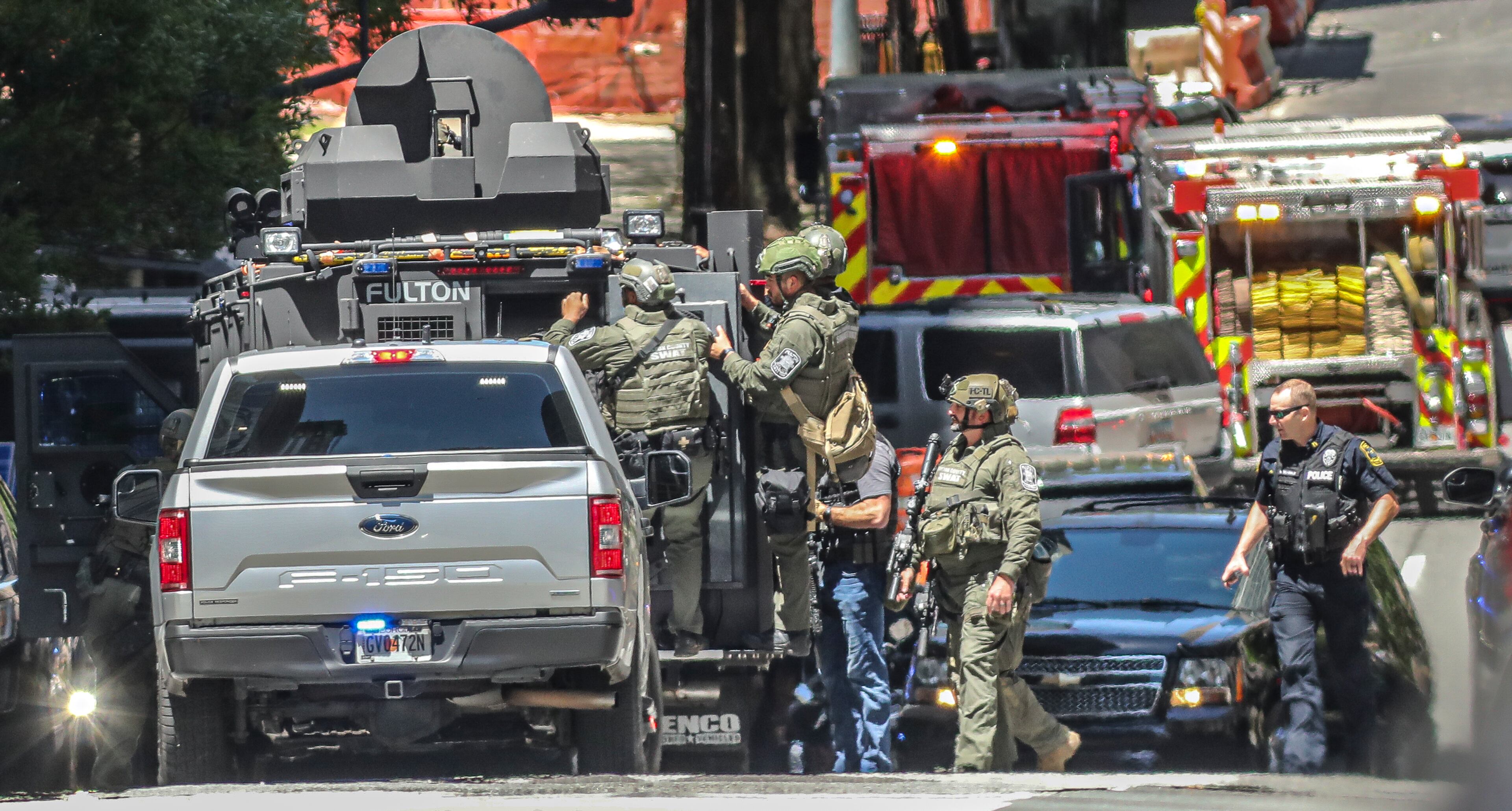 Atlanta police and a multi-jurisdiction police force swarmed Midtown Atlanta on Wednesday, May 3,2023, after five people were shot by an active shooter. This photo was taken while the suspect was still at large. (John Spink / John.Spink@ajc.com)