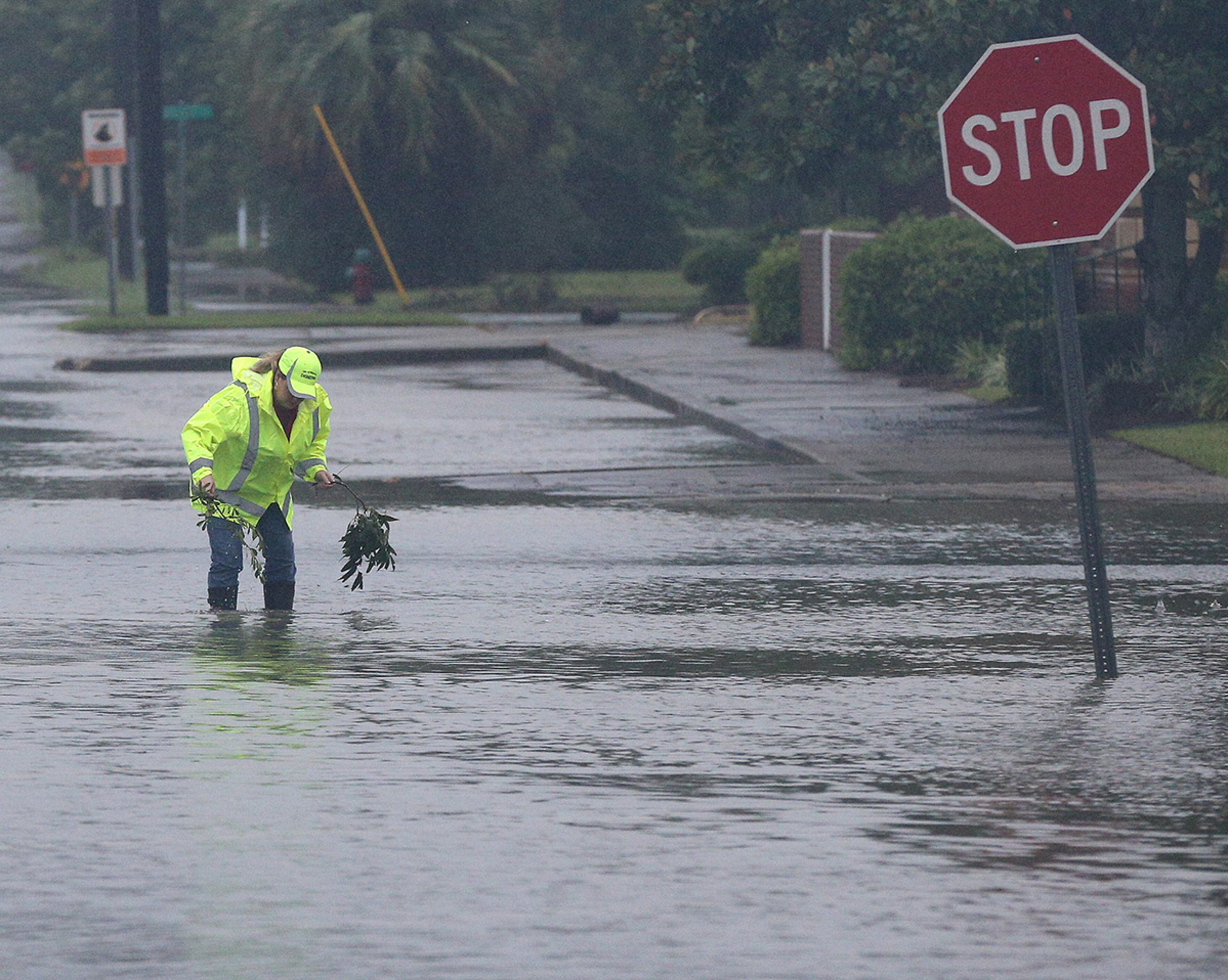 September 11, 2017 Waycross: A city employee works to clear storm drains on flooded Isabella Street in the downtown area as Hurricane Irma moves through the city on Monday, September 11, 2017, in Waycross. Curtis Compton/ccompton@ajc.com