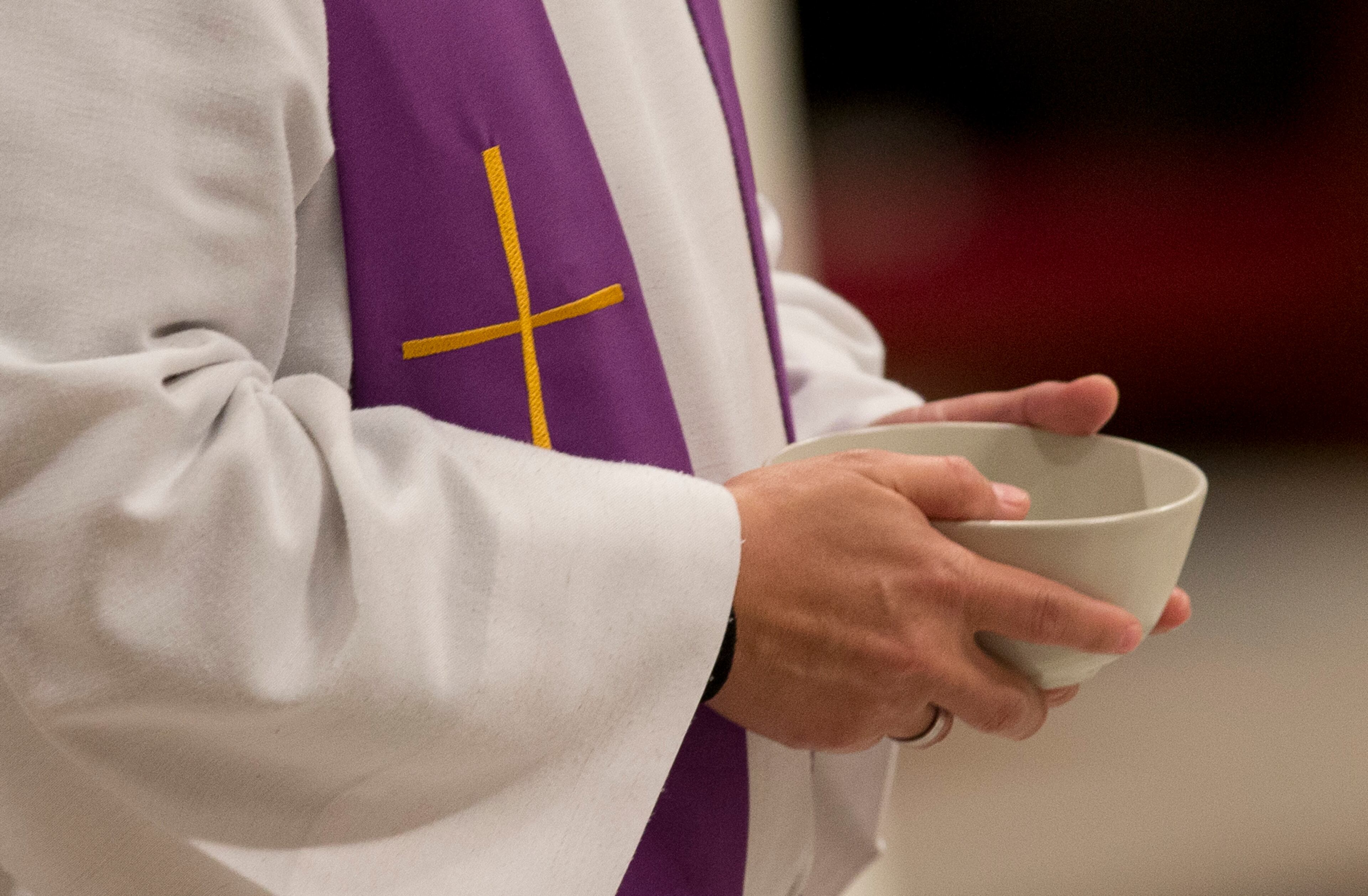 A priest holds ashes during the Ash Wednesday mass, in St. Peter's Basilica at the Vatican, Wednesday, Feb. 10, 2016. Pope Francis has smudged ashes on the bowed heads of prelates, nuns and ordinary Catholics during Ash Wednesday Mass in St. Peter�s Basilica. The ritual marks the start of Lent, a period of penitence, prayer and self-sacrifice as faithful prepare for Easter. (AP Photo/Alessandra Tarantino)