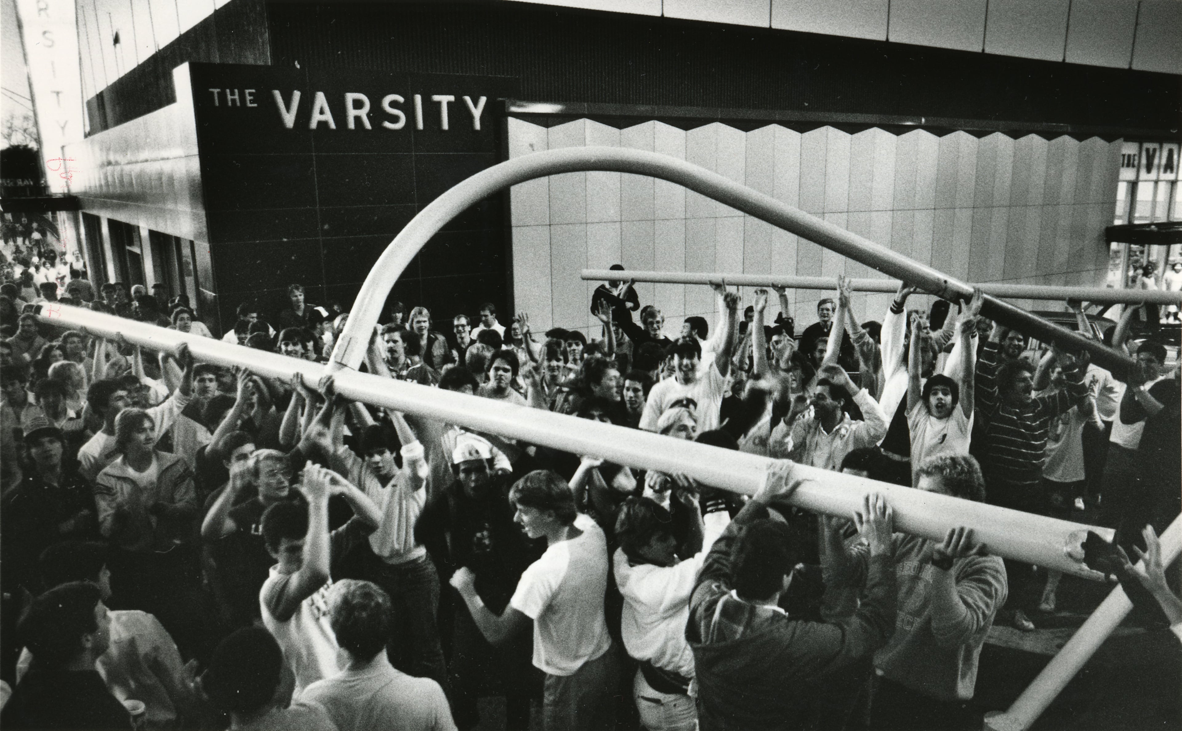 Original size is 75p.
Copy B/W photo: Georgia Tech students carried the goal posts from Grant Field to the Varsity restaurant after Tech beat UGA in Athens. (AJC FILE PHOTO: JOEY IVANSCO/STAFF).