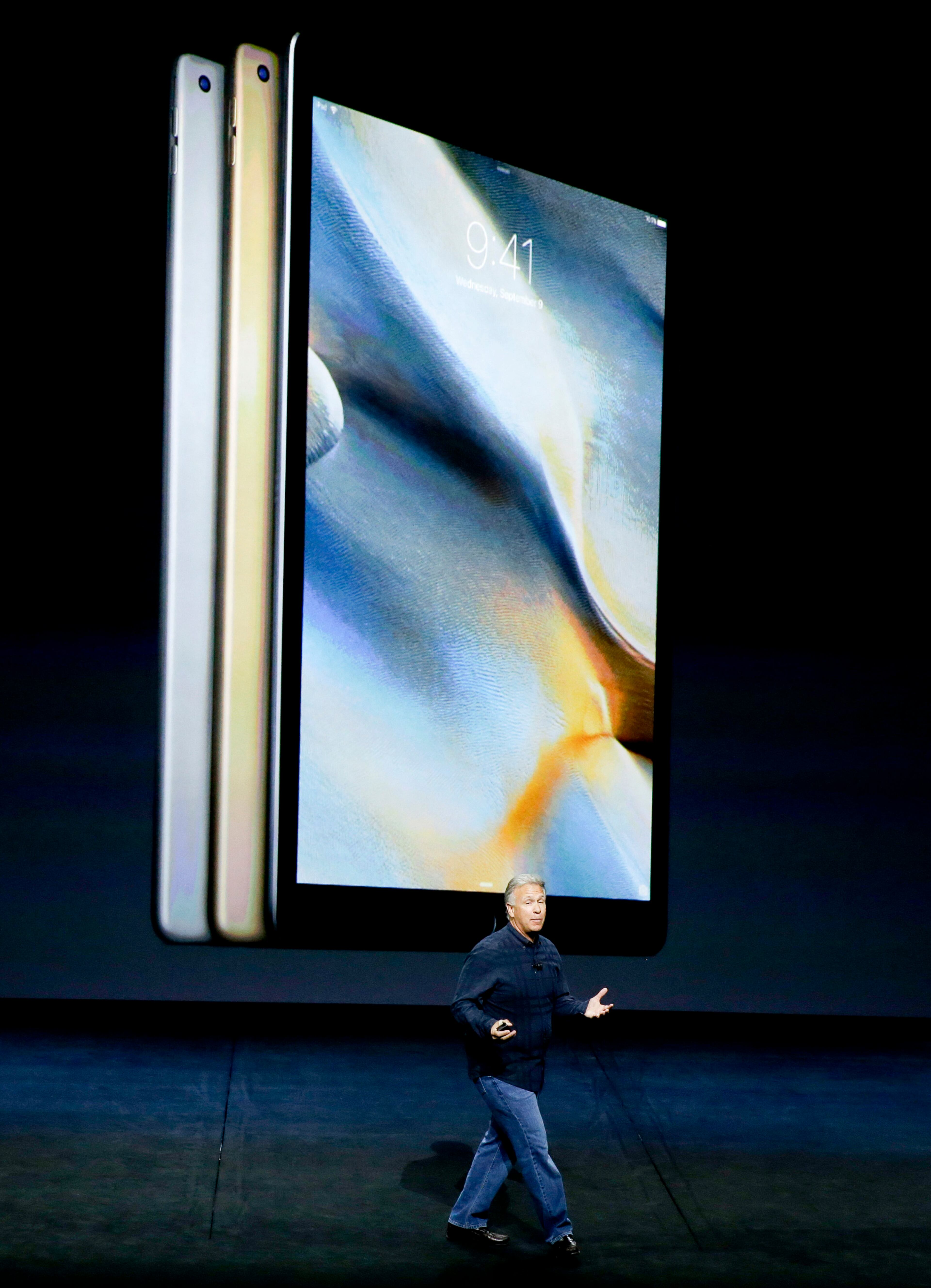 Phil Schiller, Apple's senior vice president of worldwide marketing, discusses the new iPad Pro during the Apple event at the Bill Graham Civic Auditorium in San Francisco, Wednesday, Sept. 9, 2015. (AP Photo/Eric Risberg)