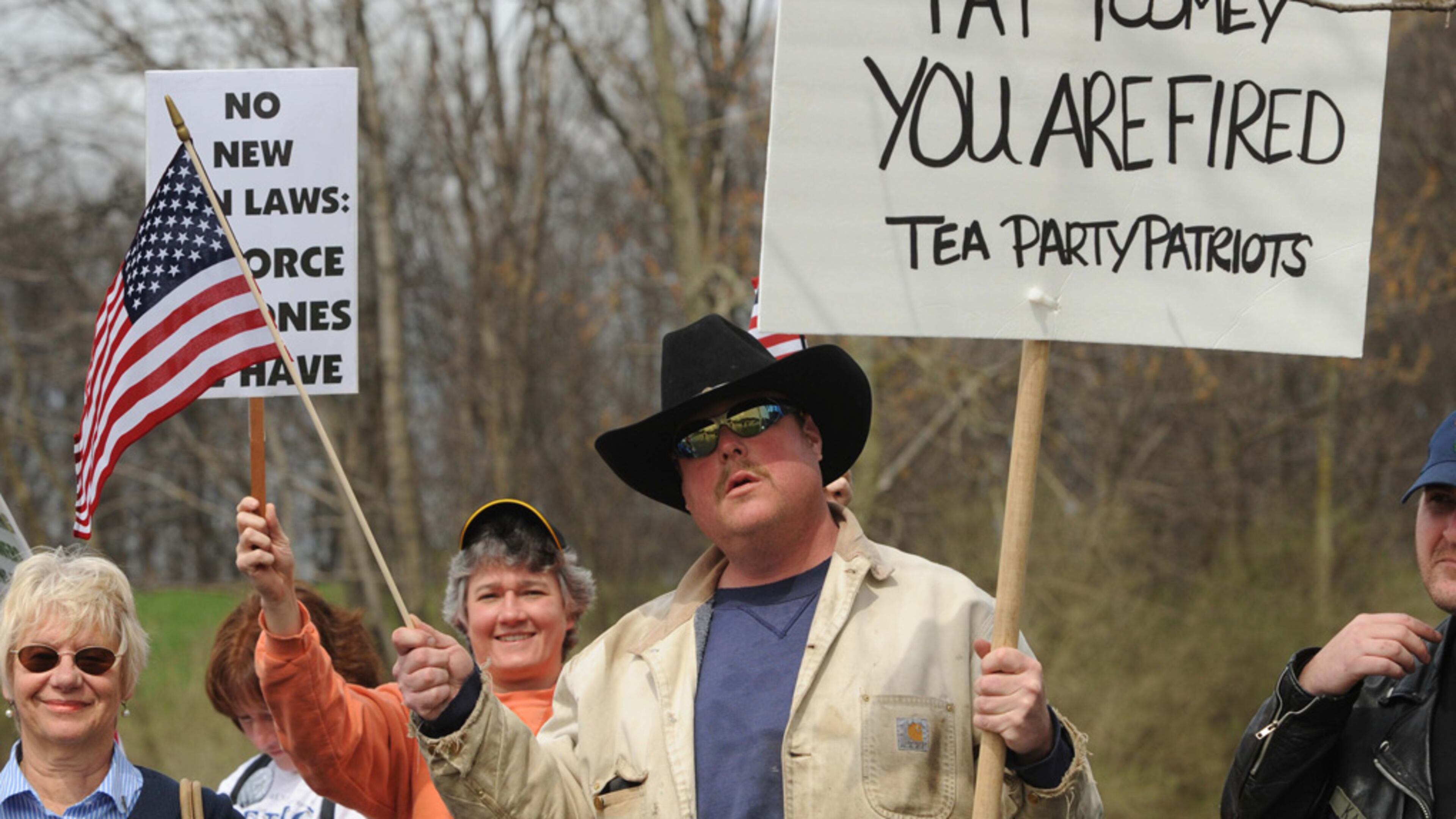 Tea Party protestor Greg Hetherington holds a sign during a second amendment protest rally held outside Senator Pat Toomey's Johnstown, Pa. office on Tuesday, April 16, 2013. (AP Photo/The Tribune-Democrat, Todd Berkey) THE MORNING CALL OUT; DAILY AMERICAN OUT; WJAC-TV OUT