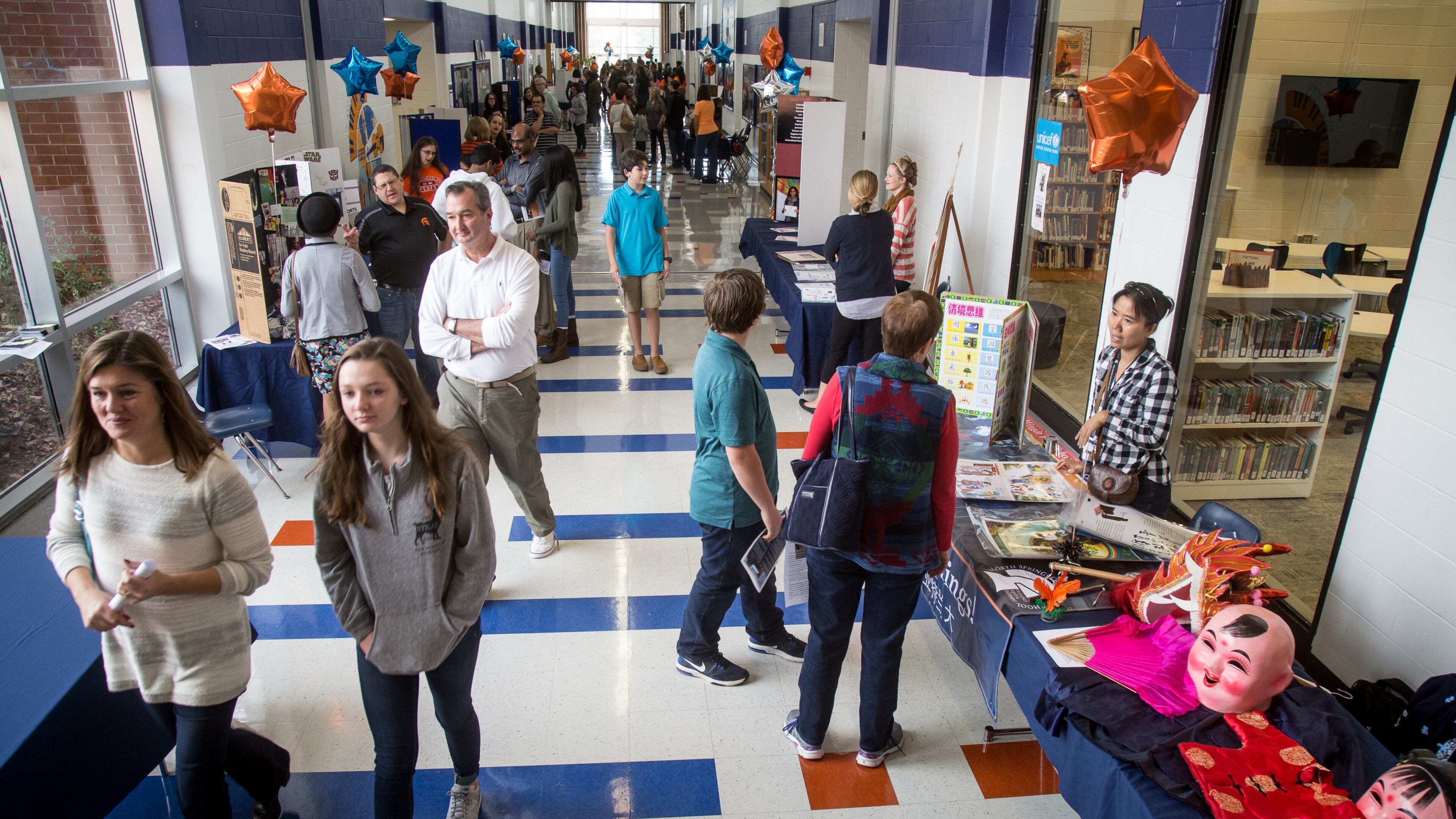 Parents and potential new students walk the halls of North Springs Charter High School during the school's open house Sunday in Sandy Springs in 2016. STEVE SCHAEFER / SPECIAL TO THE AJC