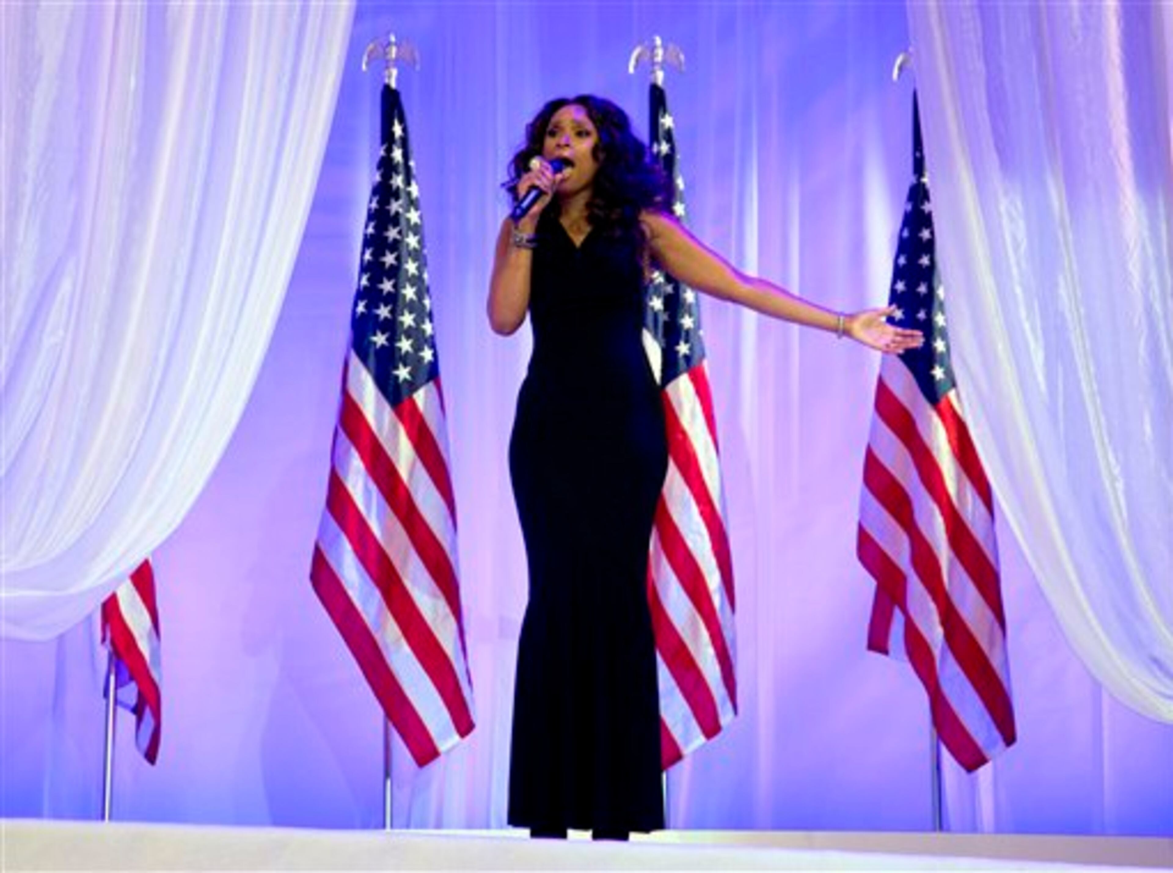 Jennifer Hudson sings as President Barack Obama and first lady Michelle Obama dance together at an Inaugural Ball, Monday, Jan. 21, 2013, at the Washington Convention Center in Washington, during the 57th Presidential Inauguration. (AP Photo/Carolyn Kaster)
