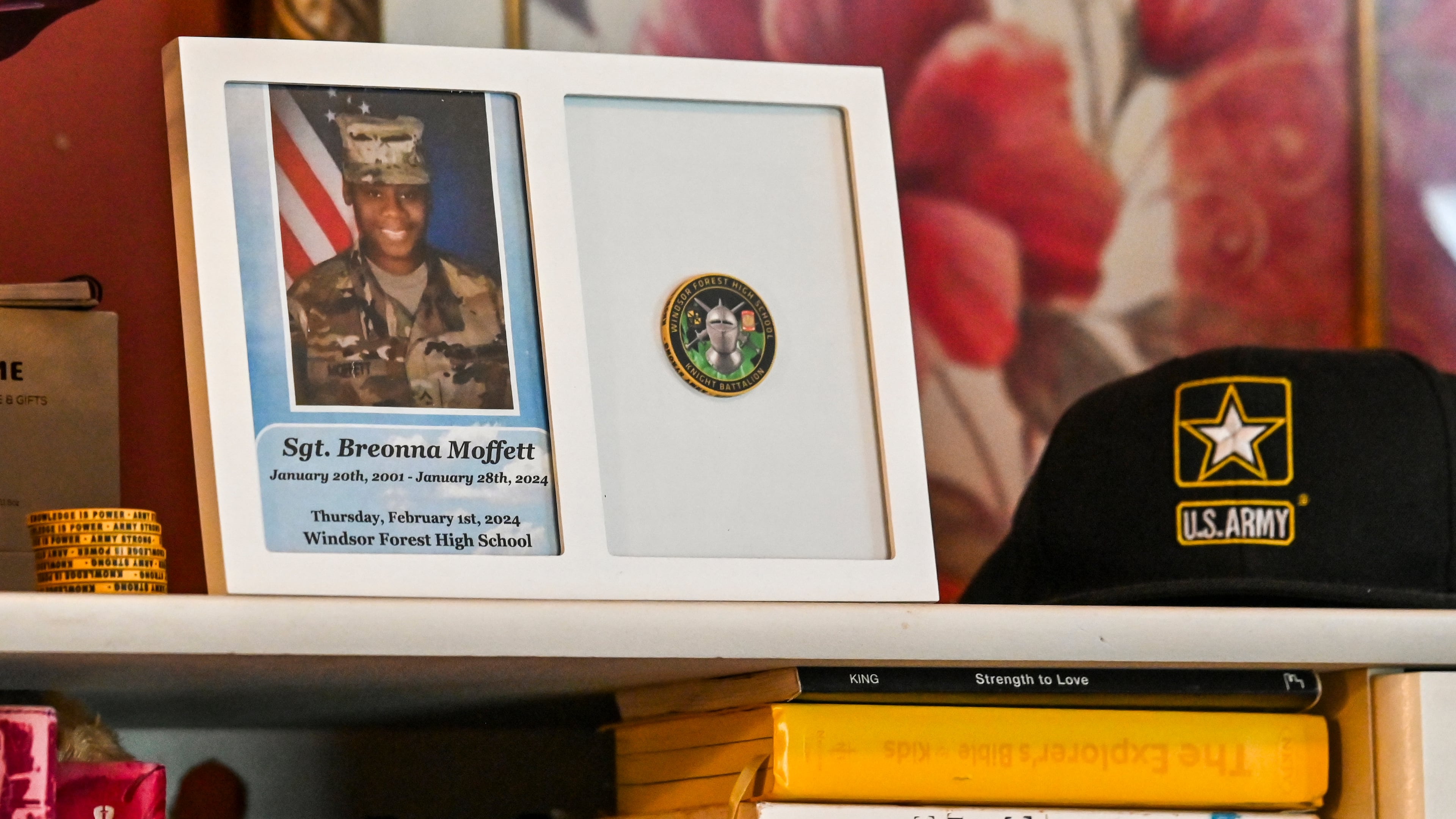 Mementos of Sgt. Breonna Moffett line a shelf at Francine and Percell Moffett's family home in Savannah. (Sarah Peacock for the AJC)