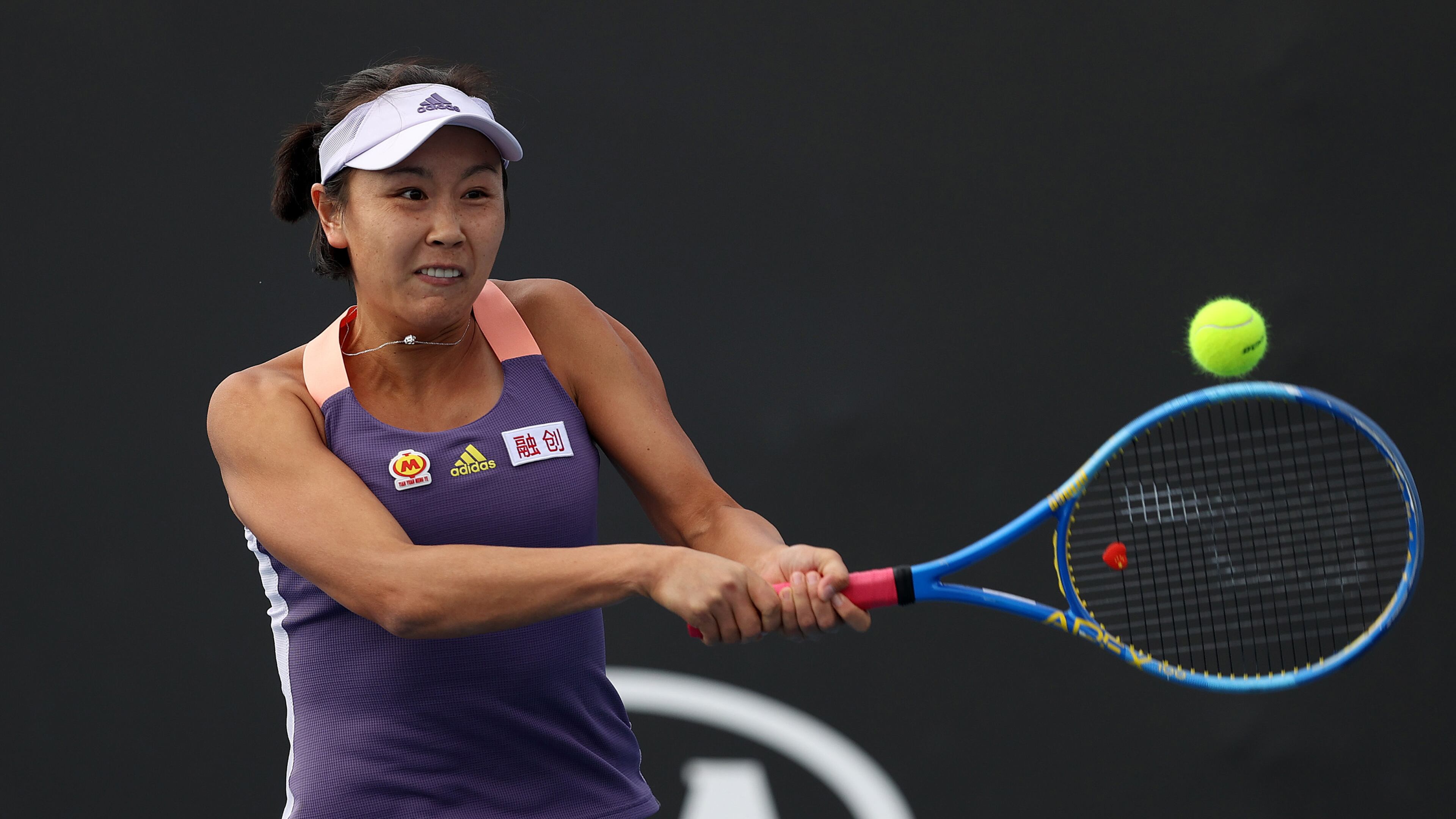 China's Shuai Peng plays a backhand during her Women's Doubles match in the first round of the Australian Open at Melbourne Park on Jan. 23, 2020, in Melbourne, Australia.