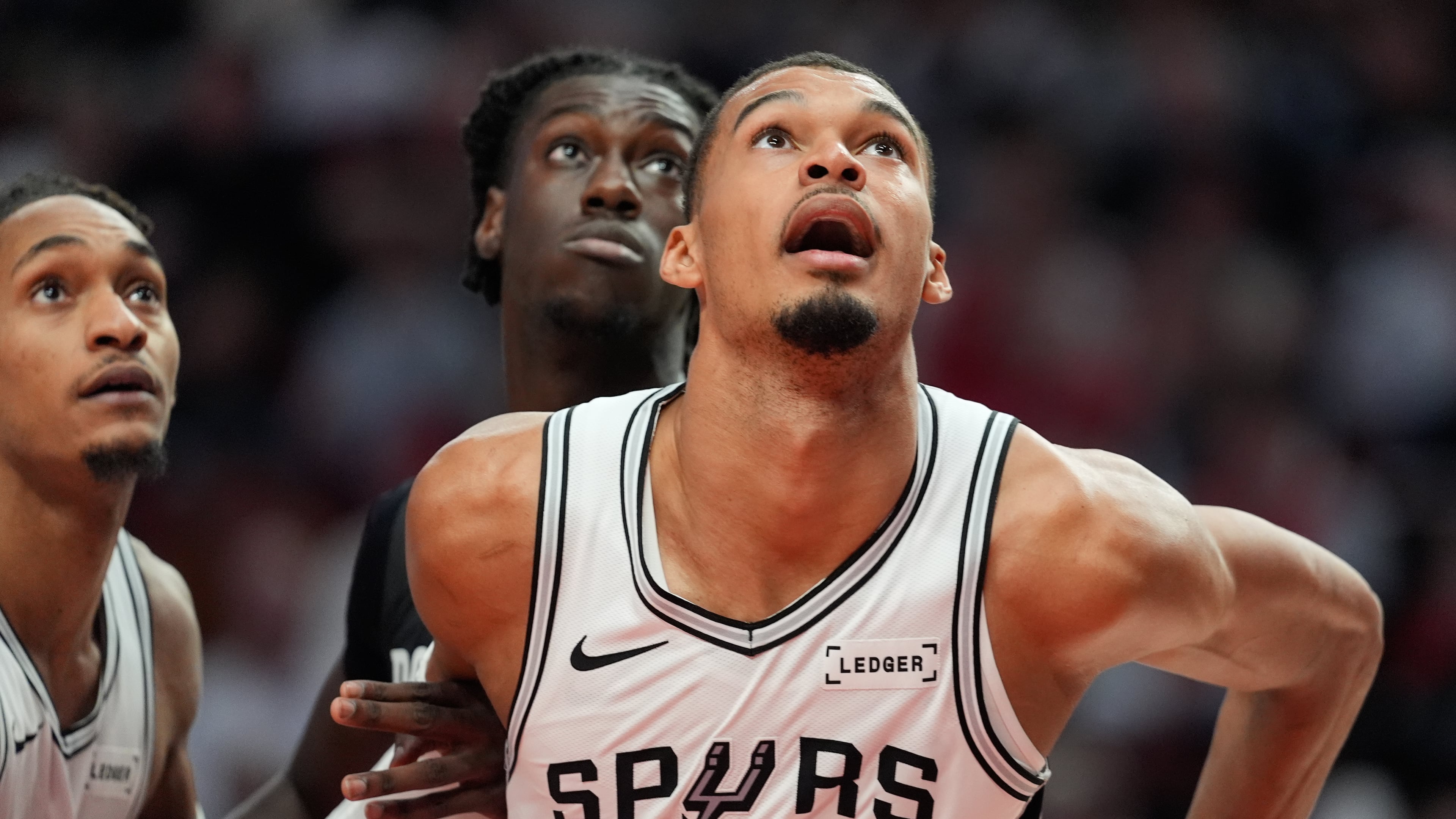 San Antonio Spurs forward/center Victor Wembanyama (1) and Portland Trail Blazers guard Sidy Cissoko watch for the rebound during the second half in Game 4 of a first-round NBA basketball playoffs series in Portland, Ore., Sunday, April 26, 2026. (AP Photo/Jenny Kane)