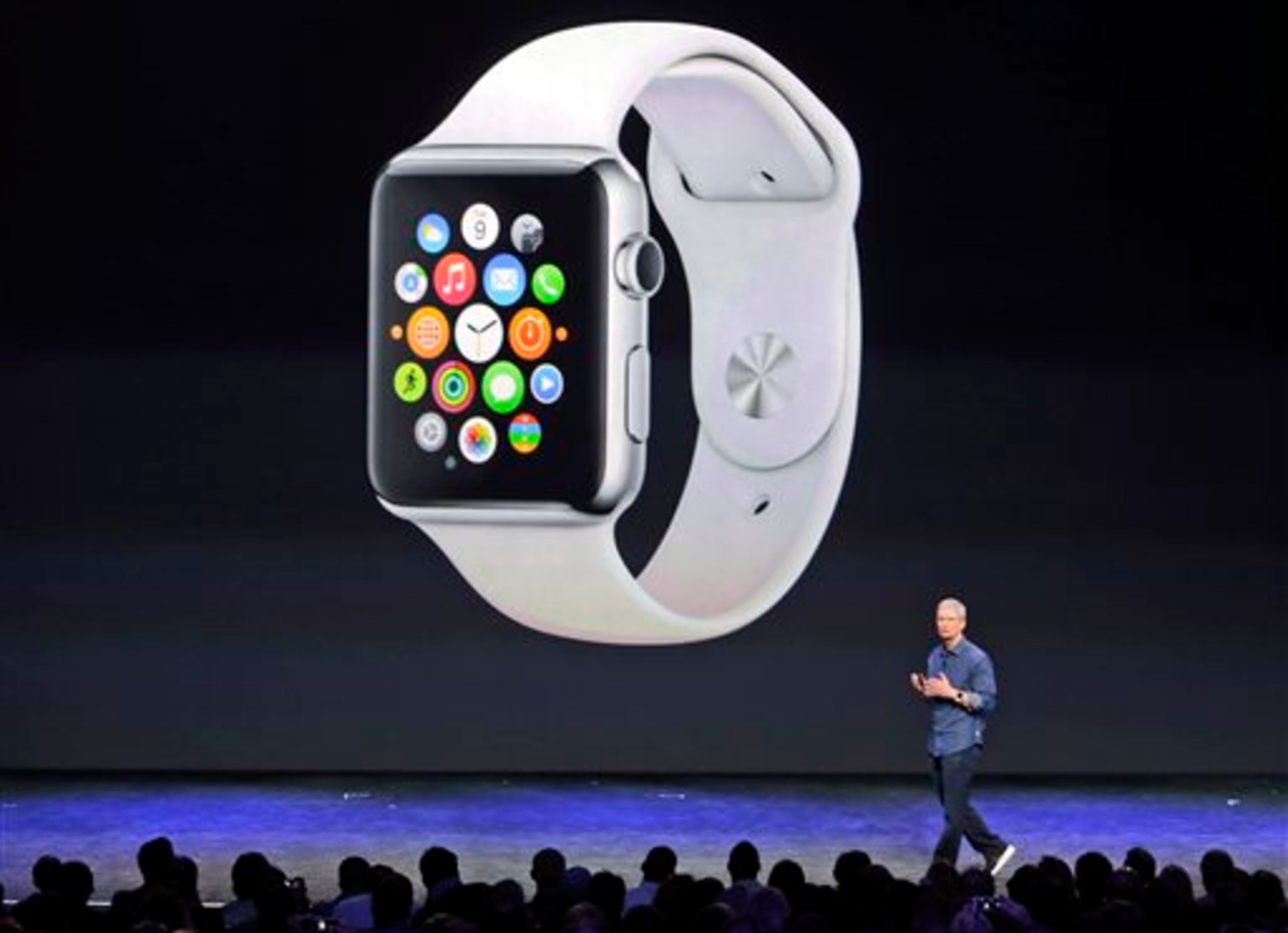 Apple CEO Tim Cook introduces the new Apple Watch on Tuesday, Sept. 9, 2014, in Cupertino, Calif. Apple's new wearable device marks the company's first major entry in a new product category since the iPad's debut in 2010. (AP Photo/Marcio Jose Sanchez)
