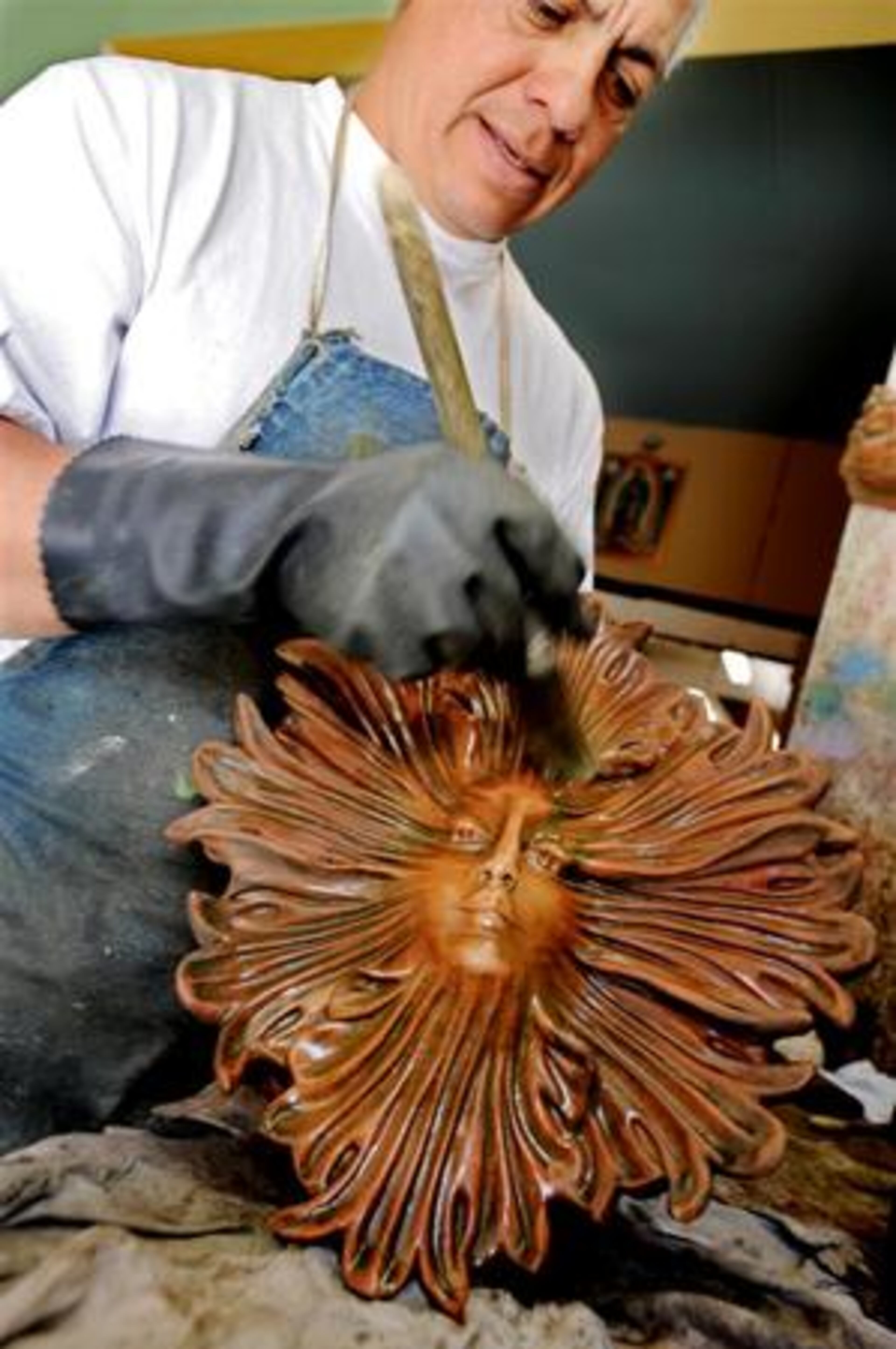 Here Montano applies a patina to one of Sibley's 'Four Season' series sculptures, Summer.