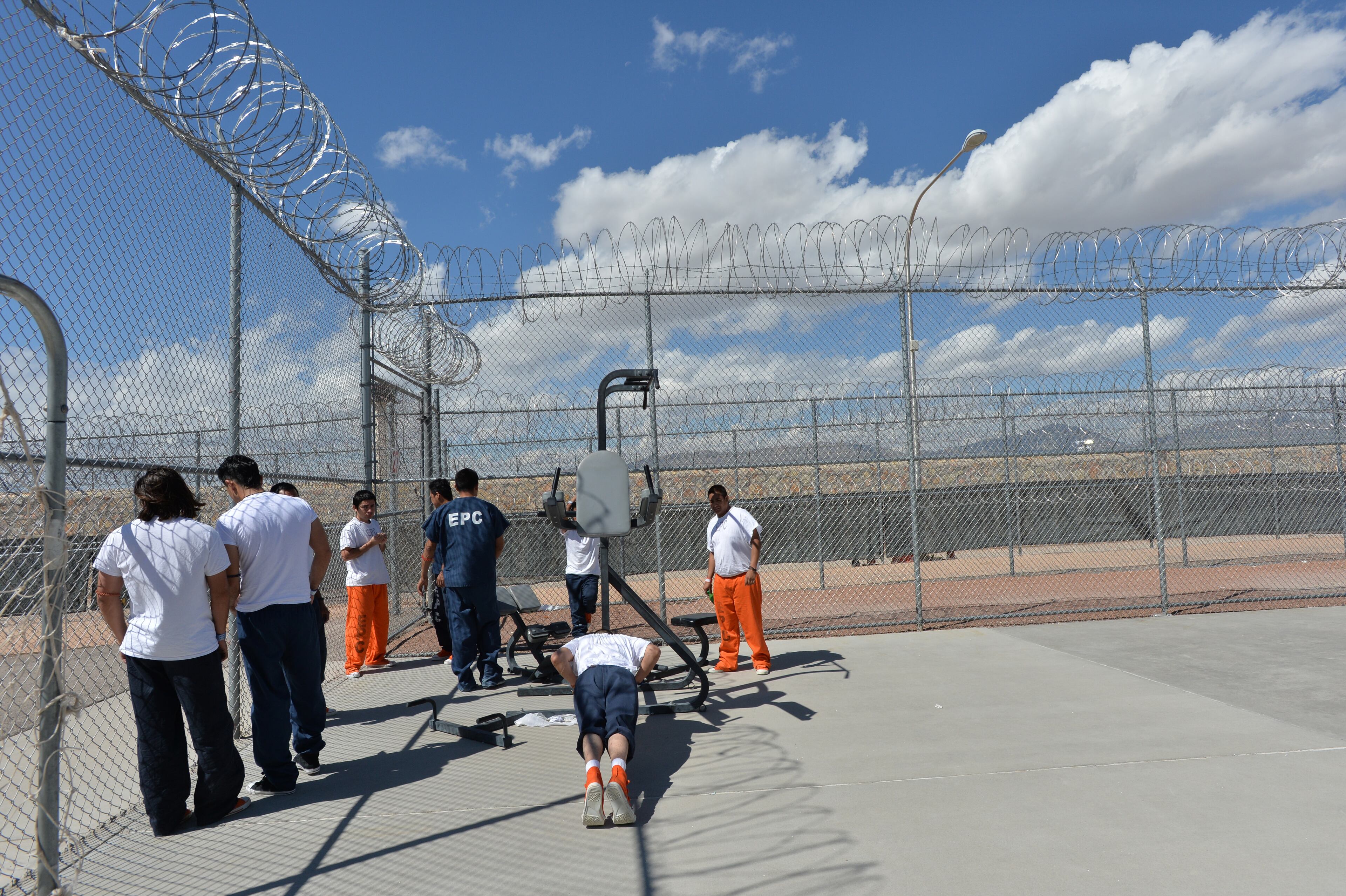 El Paso, Texas - Detainees get fresh air and exercise in the recreation yard at the El Paso Processing Center in El Paso, Texas on Friday, September 27, 2013. This bustling border city is both a gateway for illegal immigrants and the last stop many see before they are deported. Before they are expelled from the U.S., many illegal immigrants are held at the El Paso Processing Center, a razor wire-rimmed detention facility next to the city airport. HYOSUB SHIN / HSHIN@AJC.COM