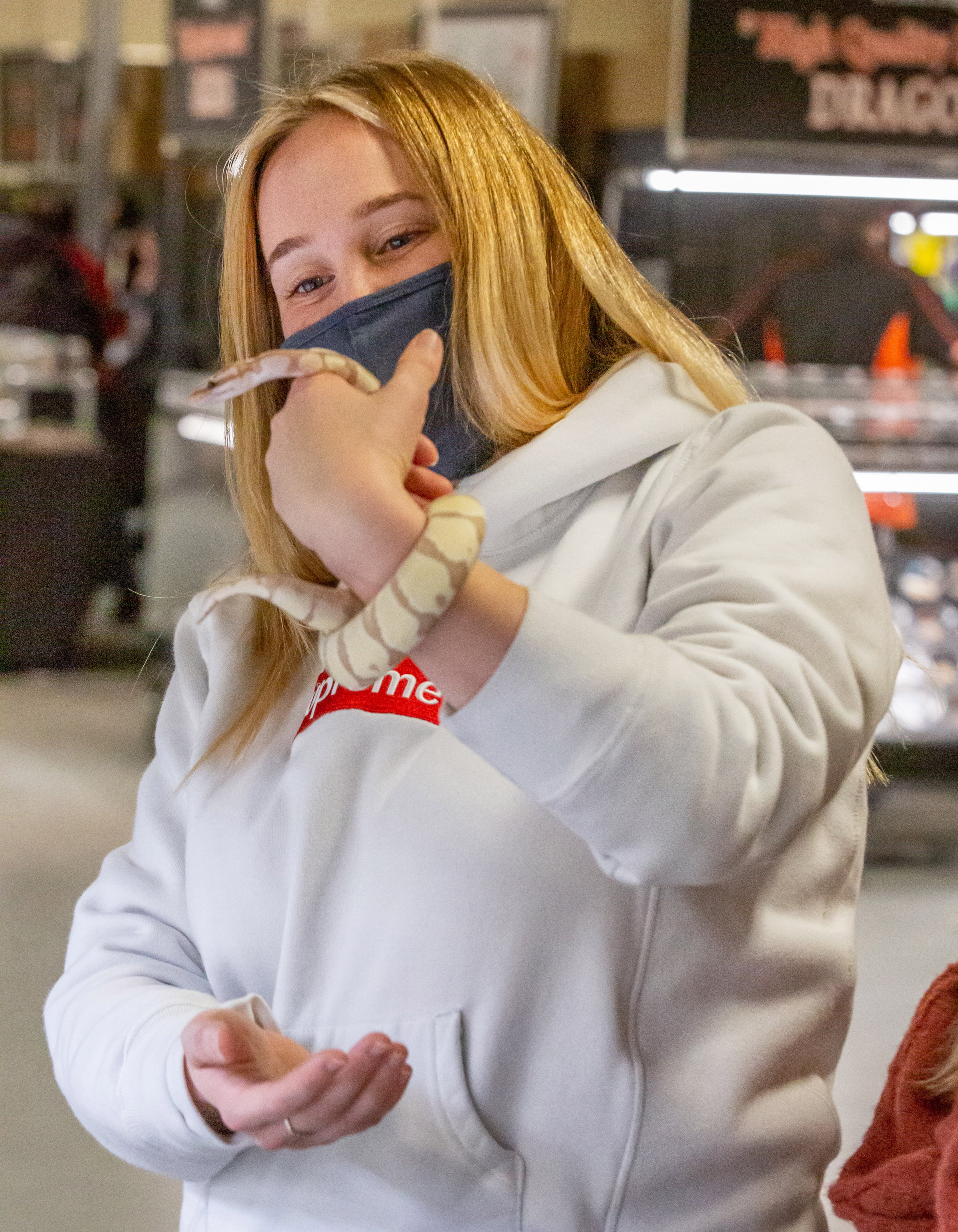 Ariel Lopez holds an Axanthic banana ball python she just bought during the reptile show Repticon Atlanta at the Gwinnett County Fairgrounds on Sunday, January 10, 2021. (Photo: Steve Schaefer for The Atlanta Journal-Constitution)