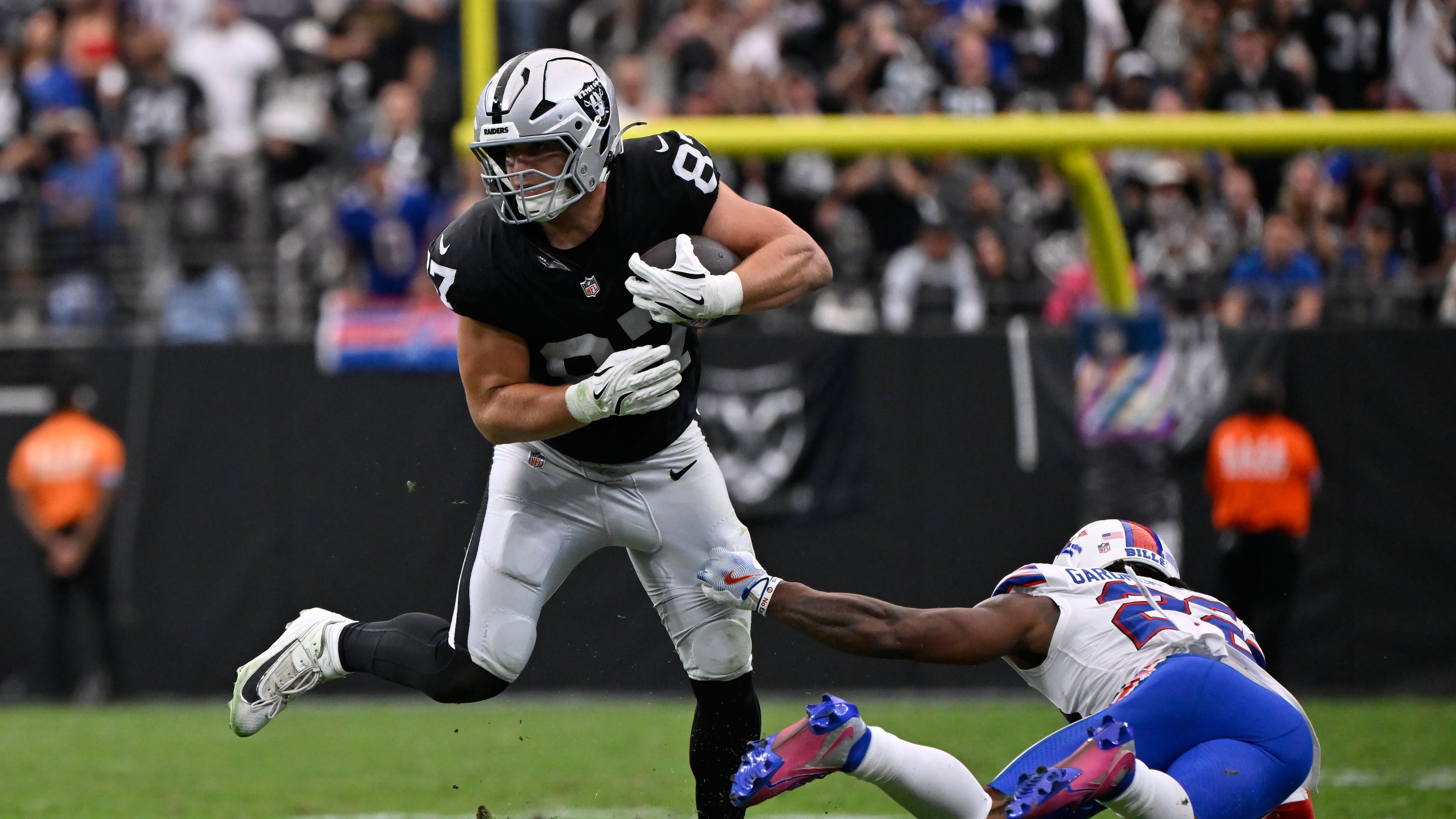 Las Vegas Raiders tight end Michael Mayer (87) makes a catch in front of Buffalo Bills safety C.J. Gardner-Johnson (22) during an NFL football game in Las Vegas, Sunday, Oct. 18, 2026. (AP Photo/David Becker)