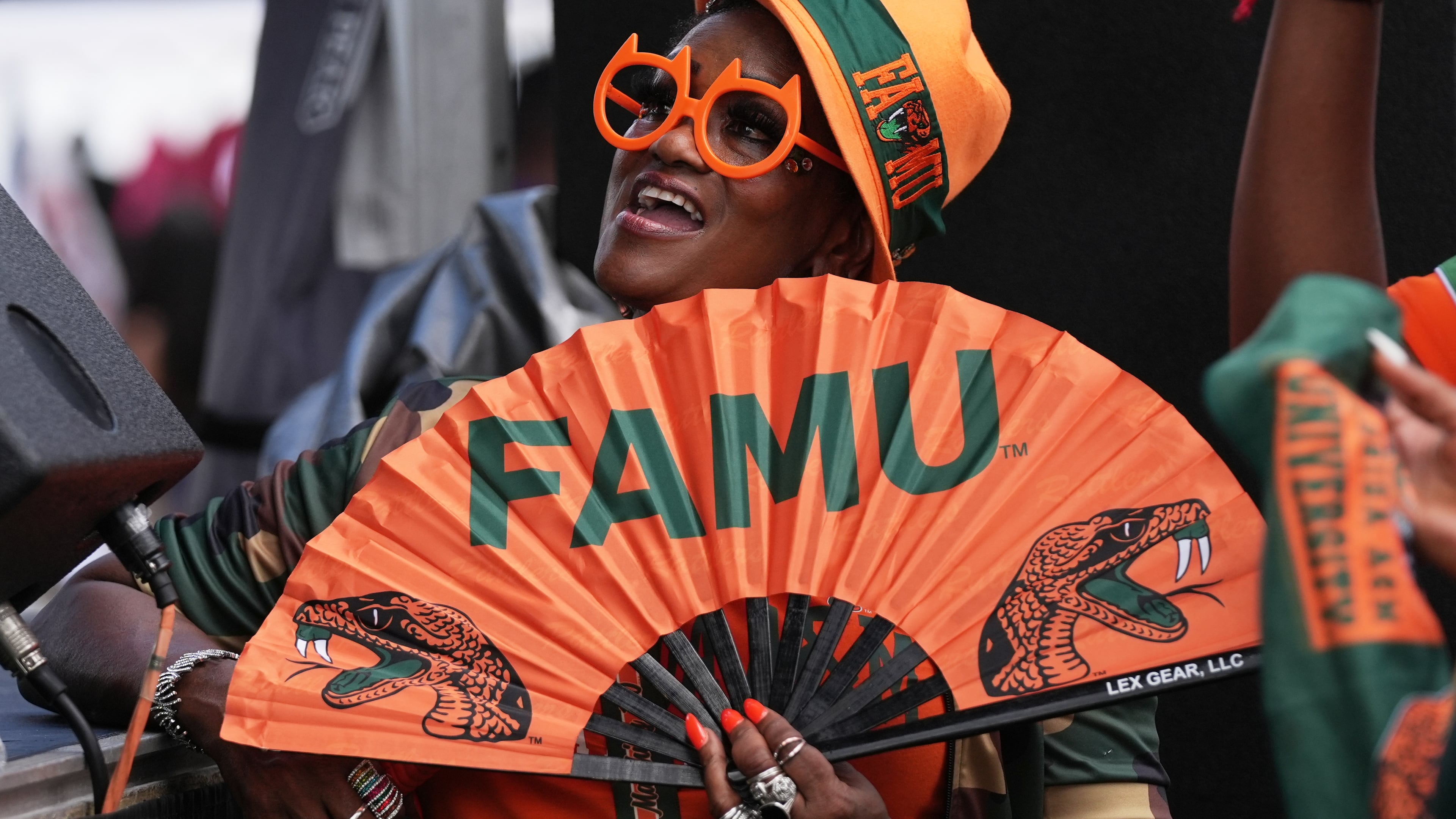 A Florida A&M fan listens to entertainment at a fan fest before the Orange Blossom Classic between Florida A&M and South Carolina State on Sunday, Sept. 6, 2026, in Miami Gardens, Fla. (Lynne Sladky/AP)