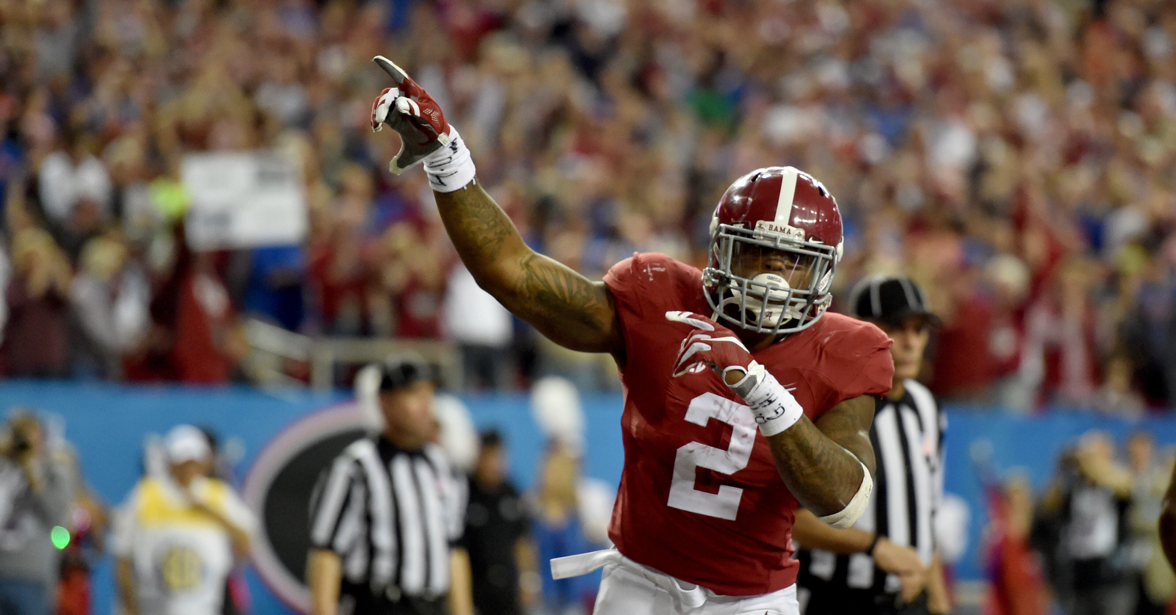 December 5, 2015 Atlanta: Alabama Crimson Tide running back Derrick Henry celebrates his first half touchdown against Florida during the SEC Championship at the Georgia Dome Saturday December 5, 2015. BRANT SANDERLIN/BSANDERLIN@AJC.COM