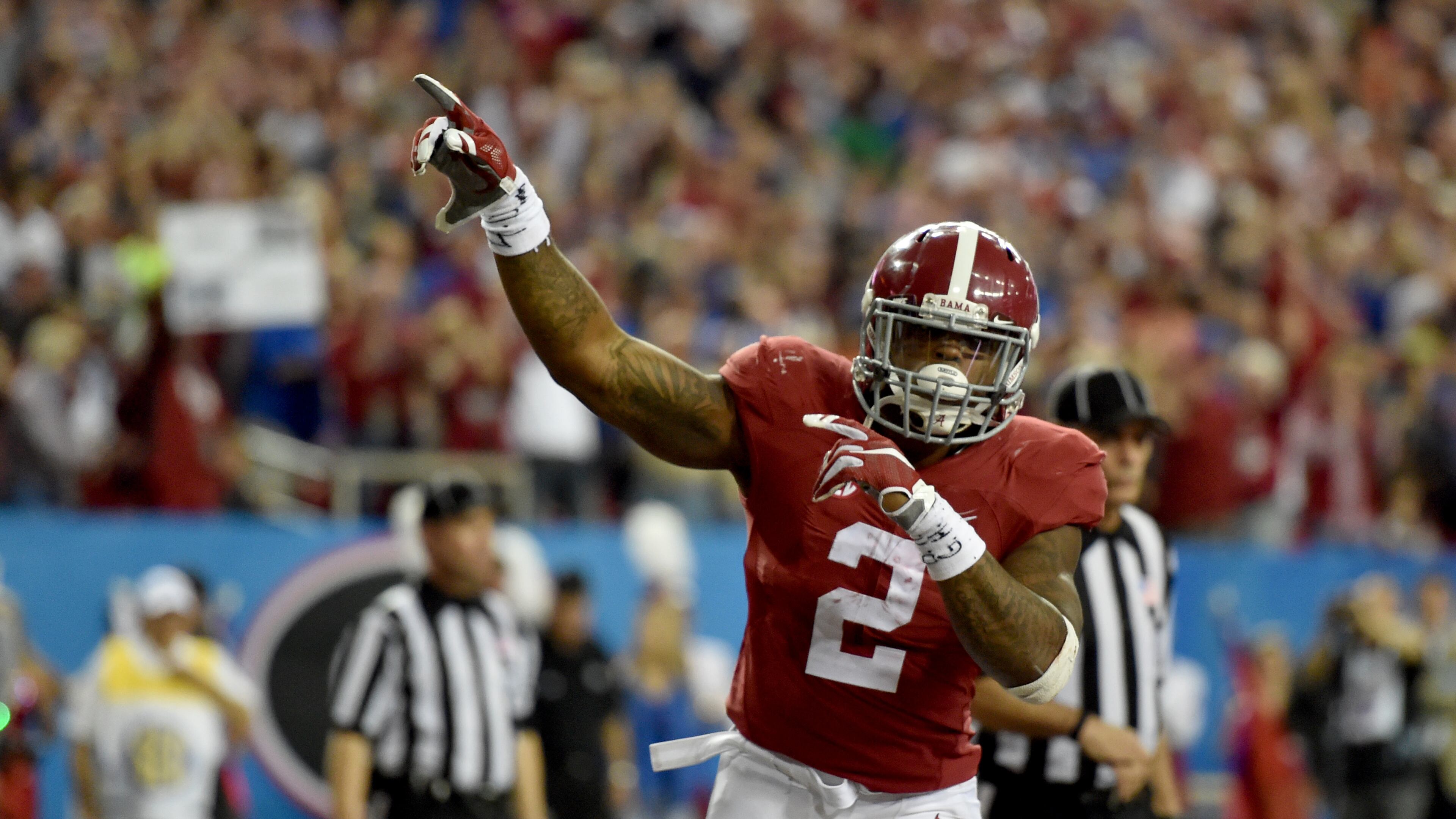 December 5, 2015 Atlanta: Alabama Crimson Tide running back Derrick Henry celebrates his first half touchdown against Florida during the SEC Championship at the Georgia Dome Saturday December 5, 2015. BRANT SANDERLIN/BSANDERLIN@AJC.COM