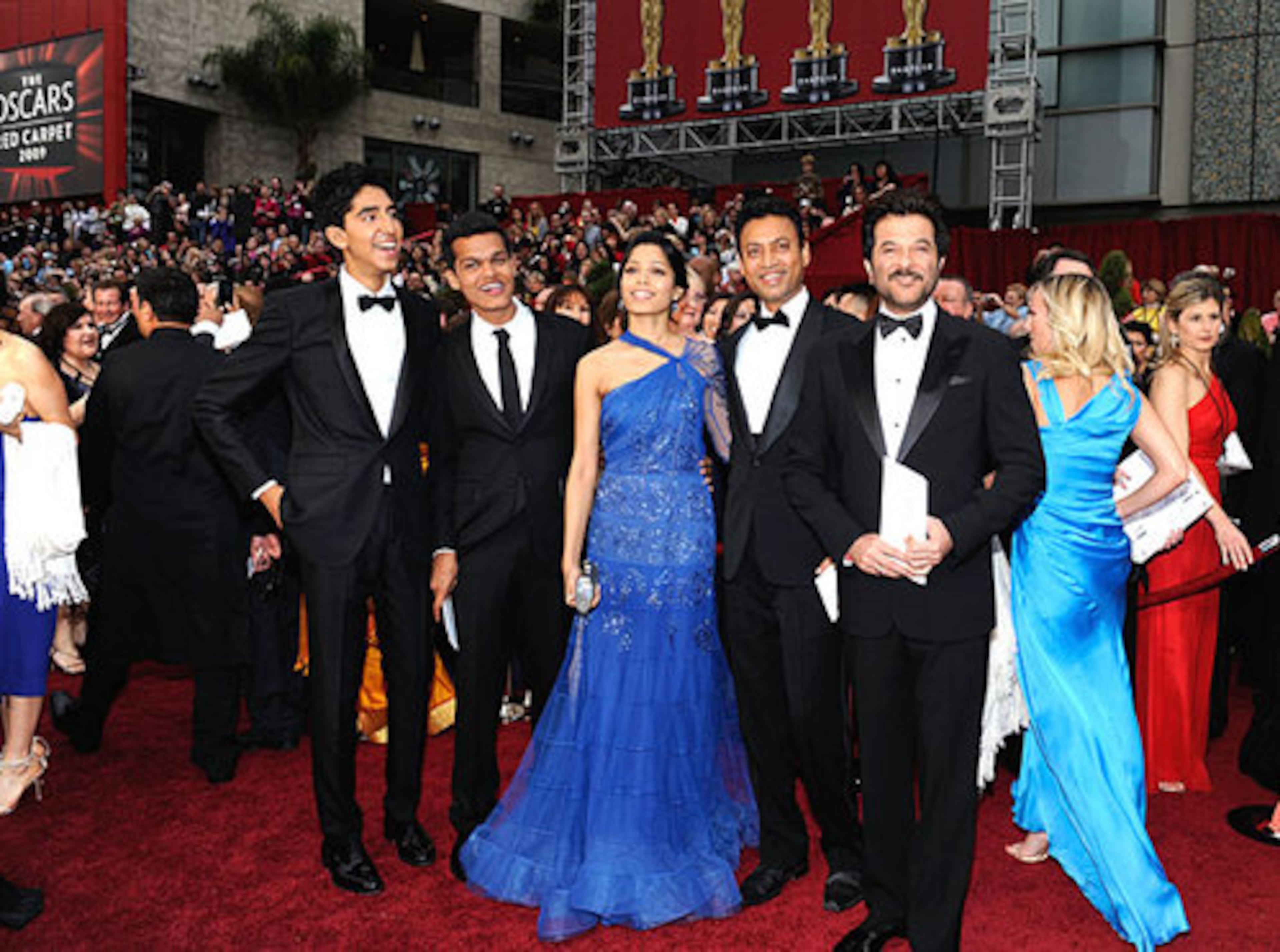 The actors who played the characters as grownups, left to right, Dev Patel (Jamal), Madhur Mittal (Salim) and Freida Pinto (Latika). To their right, Irrfan Khan, who played the police inspector, and Anil Kapoor, who played the 'Millionaire' host.