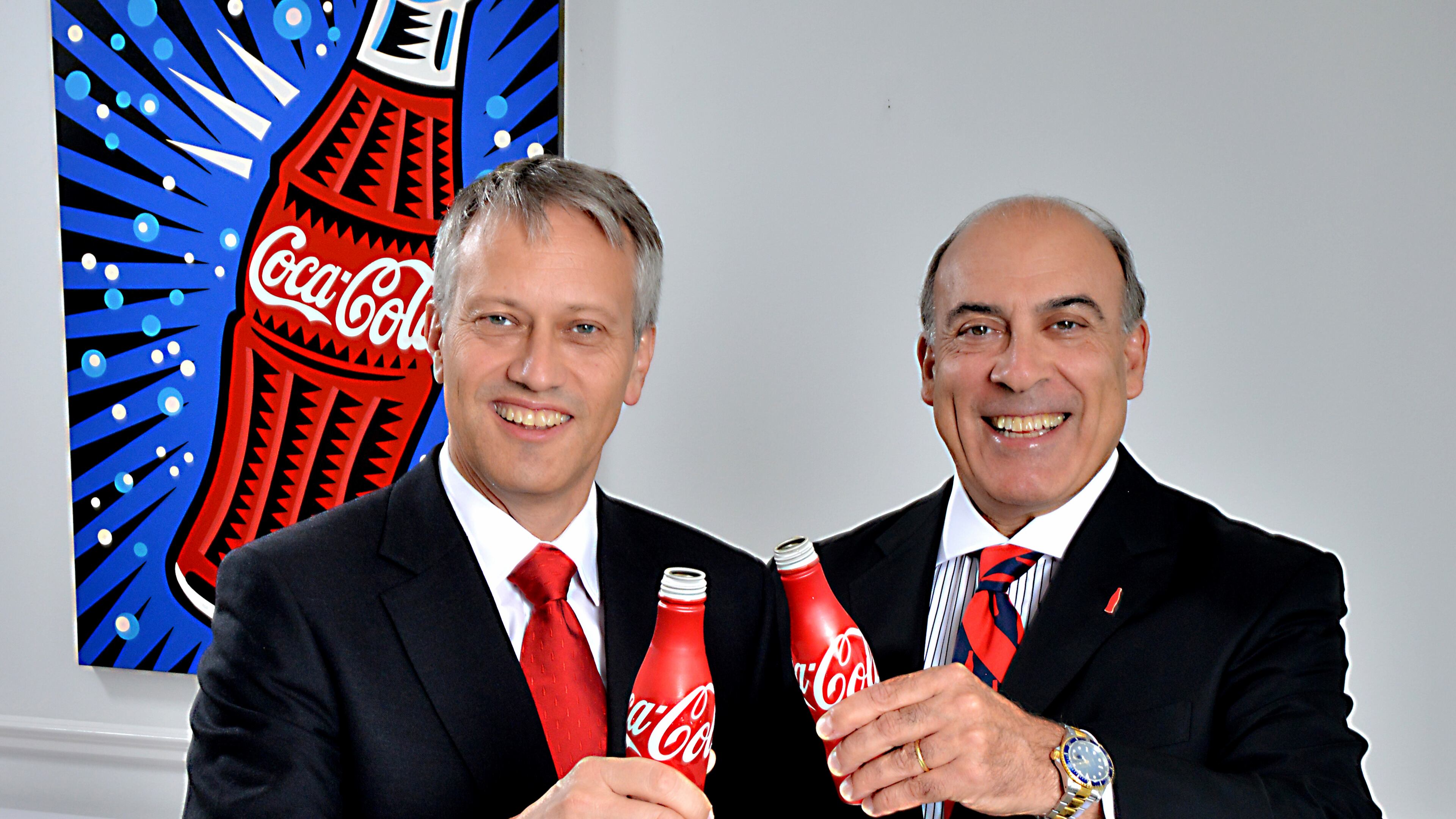 Muhtar Kent (right), Coca-Cola’s chief executive officer and chairman, and Coca-Cola President James Quincey, who will soon be stepping in as CEO, both got big raises last year despite lower profits. Photo: Coca-Cola.
