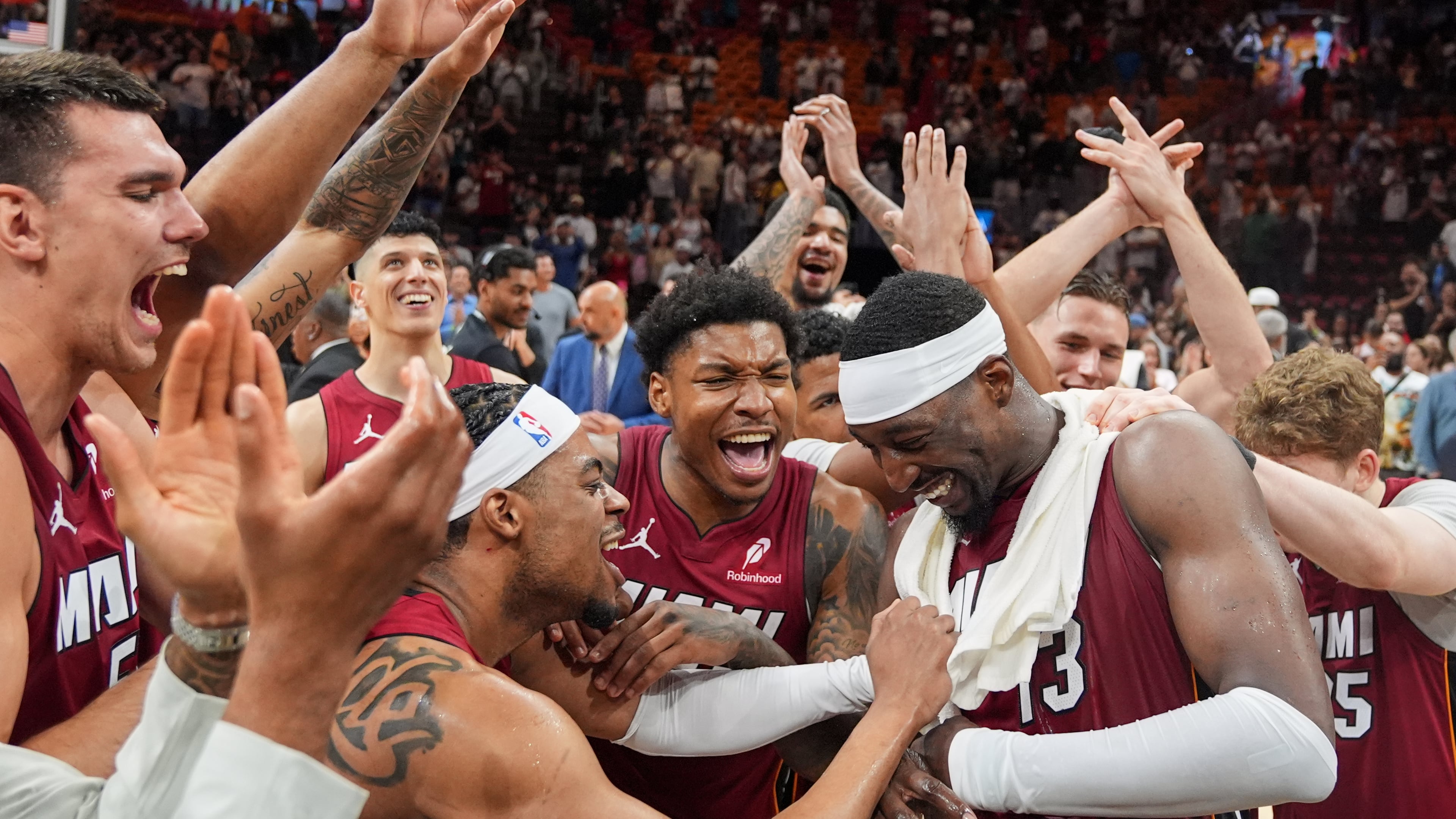 Miami Heat teammates celebrate center Bam Adebayo (13) after he scored 83 points, the second-highest single game total in NBA history, in an NBA basketball game against the Washington Wizards, Tuesday, March 10, 2026, in Miami. (AP Photo/Rebecca Blackwell)