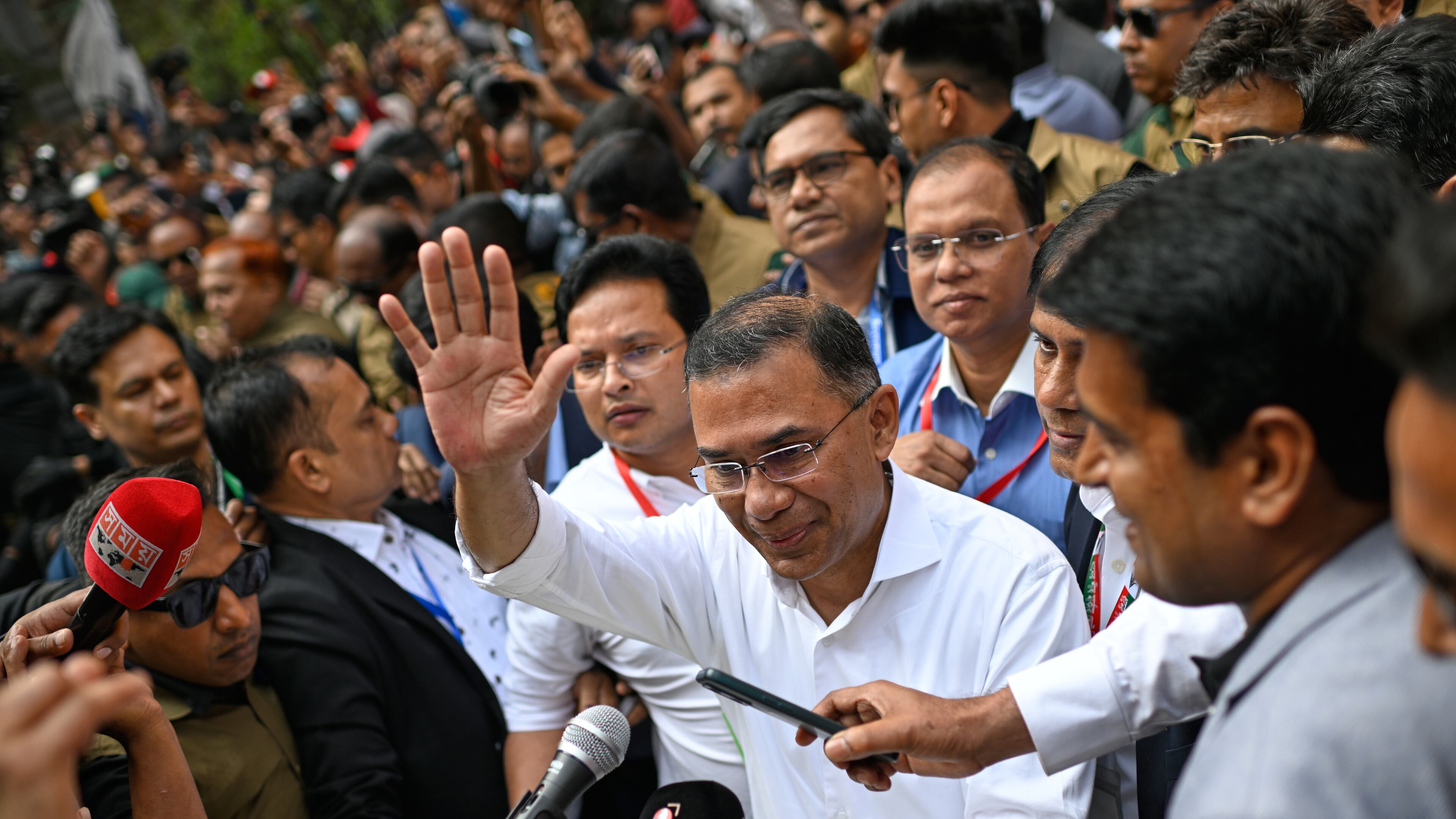 Bangladesh Nationalist Party Chairperson Tarique Rahman waves as he comes out after casting his vote during the national parliamentary elections in Dhaka, Bangladesh, Thursday, Feb. 12, 2026. (AP Photo/Mahmud Hossain Opu)