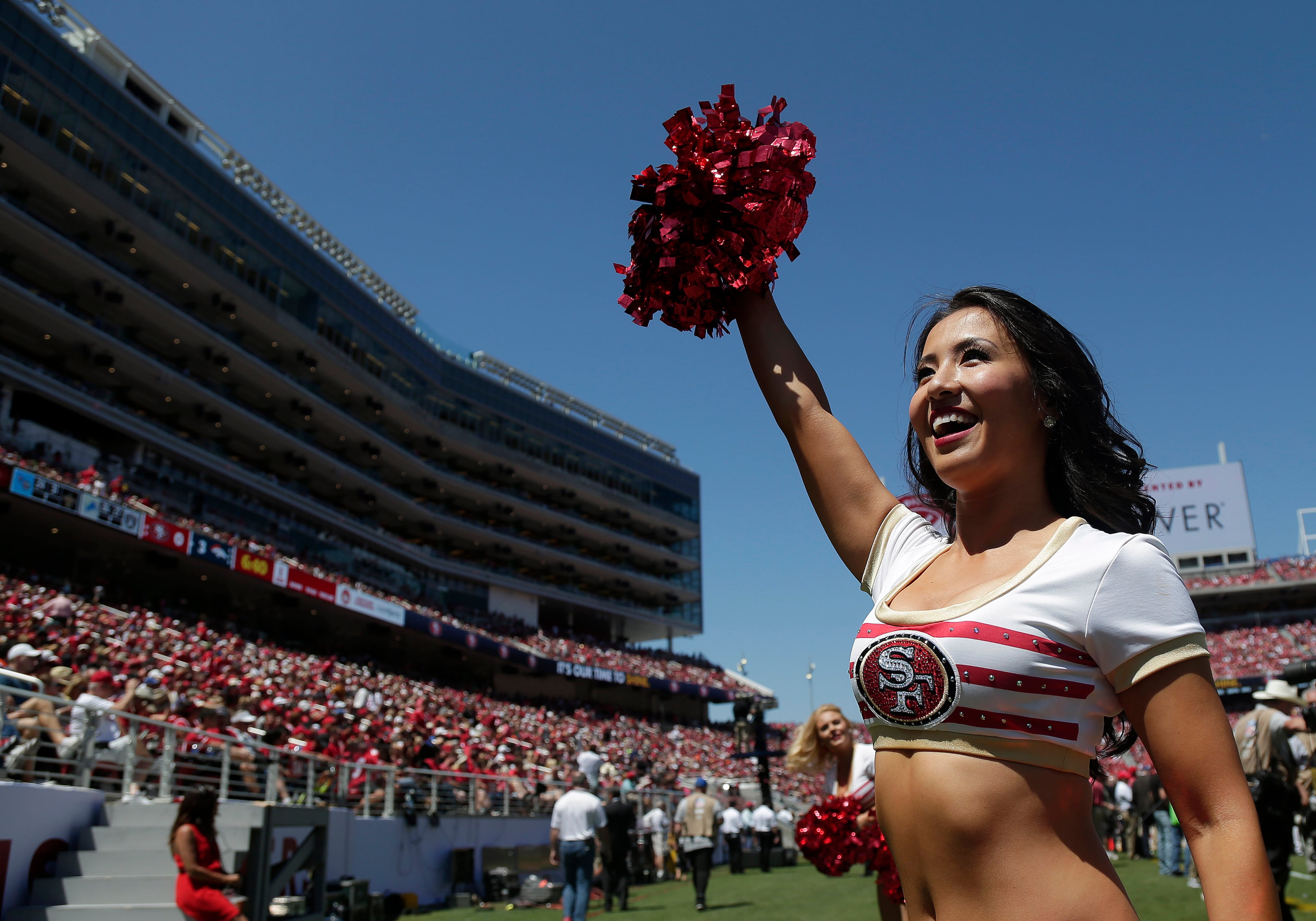 A San Francisco 49ers cheerleader performs during the first half of an NFL preseason football game against the Denver Broncos in Santa Clara, Calif., Sunday, Aug. 17, 2014. (AP Photo/Marcio Jose Sanchez)