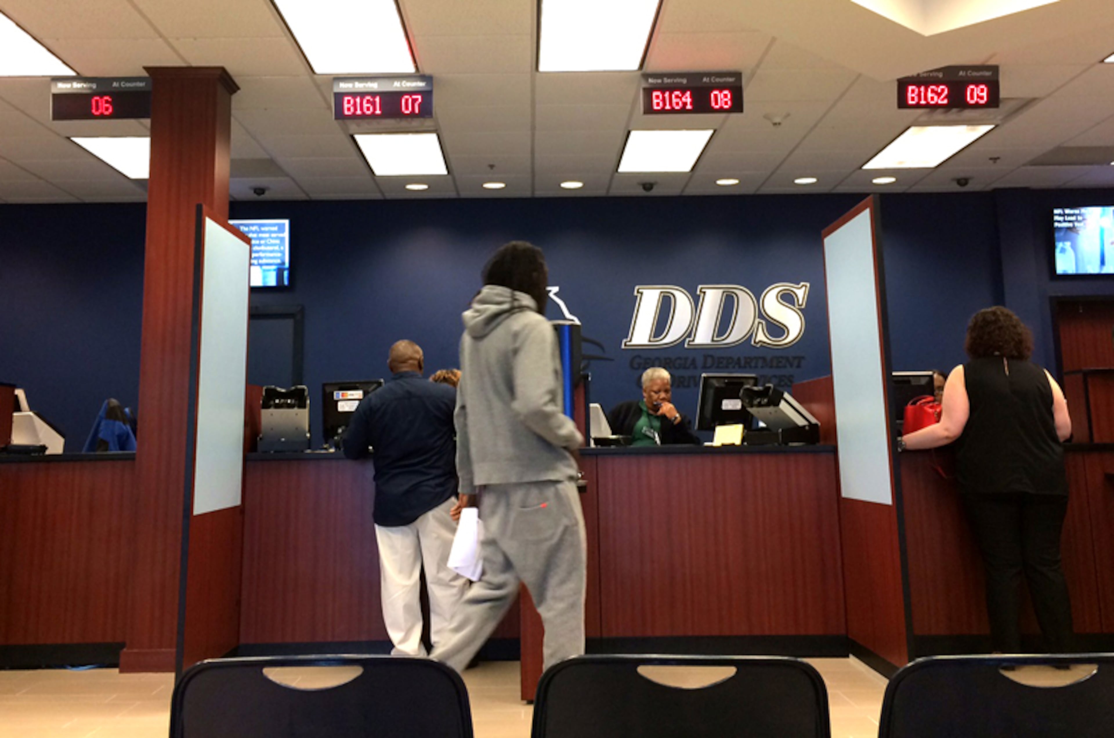 Georgia automatically registers eligible voters at driver's license offices unless they click a button to opt out.