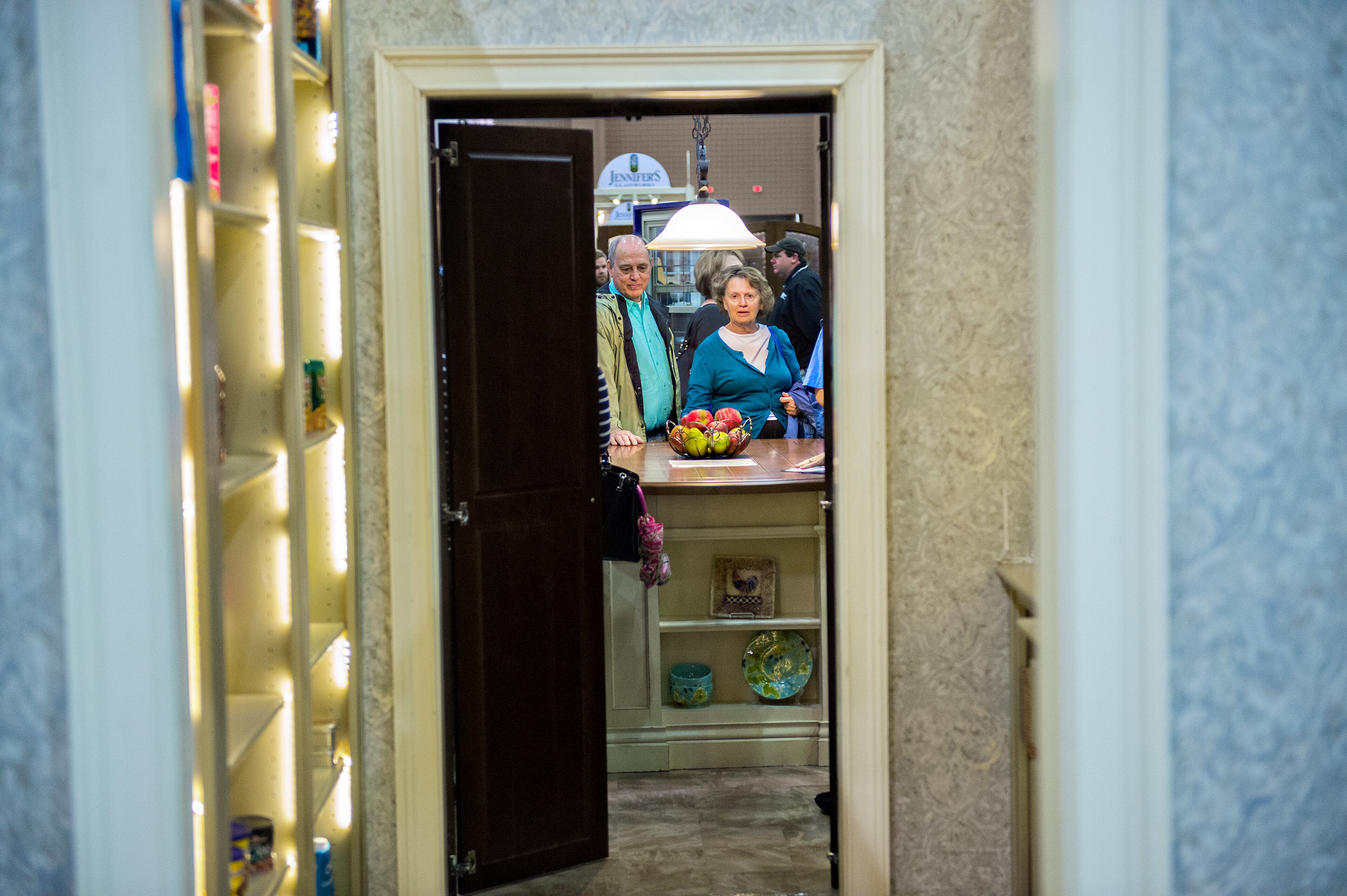 Joy Powell (center) and her husband Bob look at kitchen and storage remodeling displays during the 37th annual Spring Atlanta Home Show at the Cobb Galleria Centre in Atlanta on March 22, 2015. The three-day show featured exhibits and seminars on landscaping and lawn care, kitchen appliances, fixtures, flooring, roofing, siding, concrete, windows, heating and air conditioning, patios and insulation. JONATHAN PHILLIPS / SPECIAL