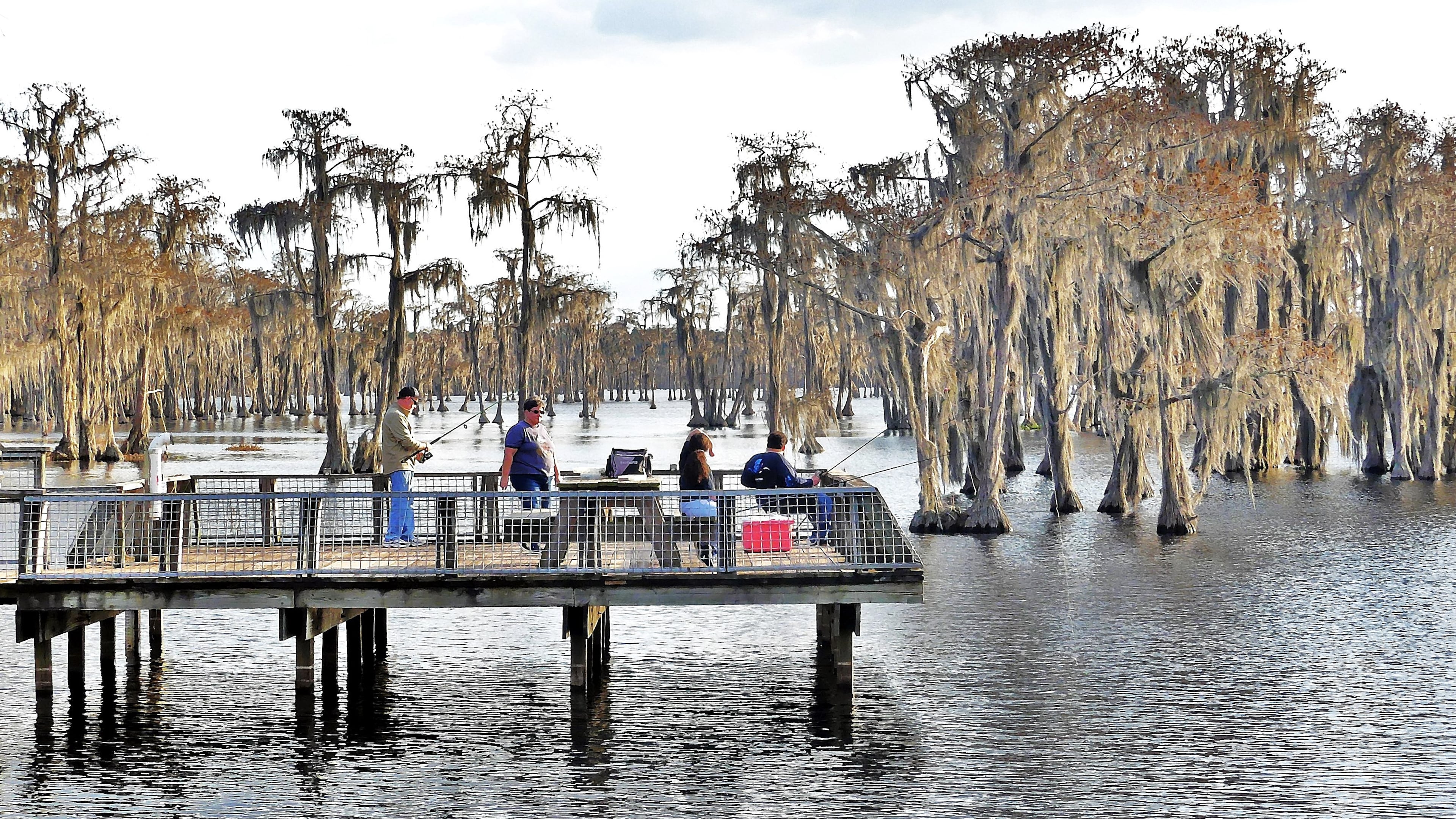 Anglers try their luck from a public dock at Banks Lake National Wildlife Refuge in Lanier County, south-central Georgia. (Charles Seabrook for the AJC)