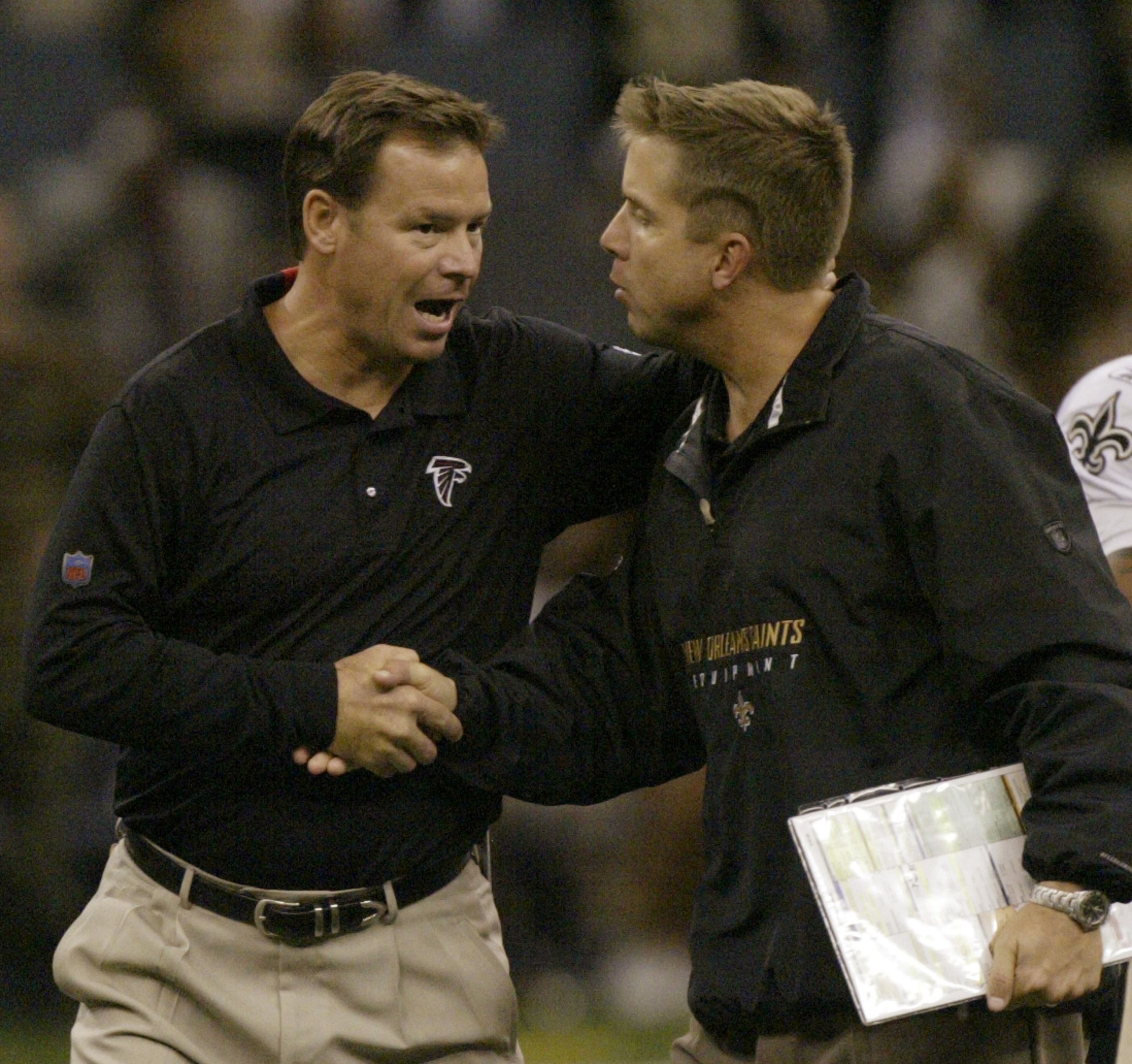 Back then handshake: Falcons coach Jim Mora (left) and Saints coach Sean Payton get together in 2006.