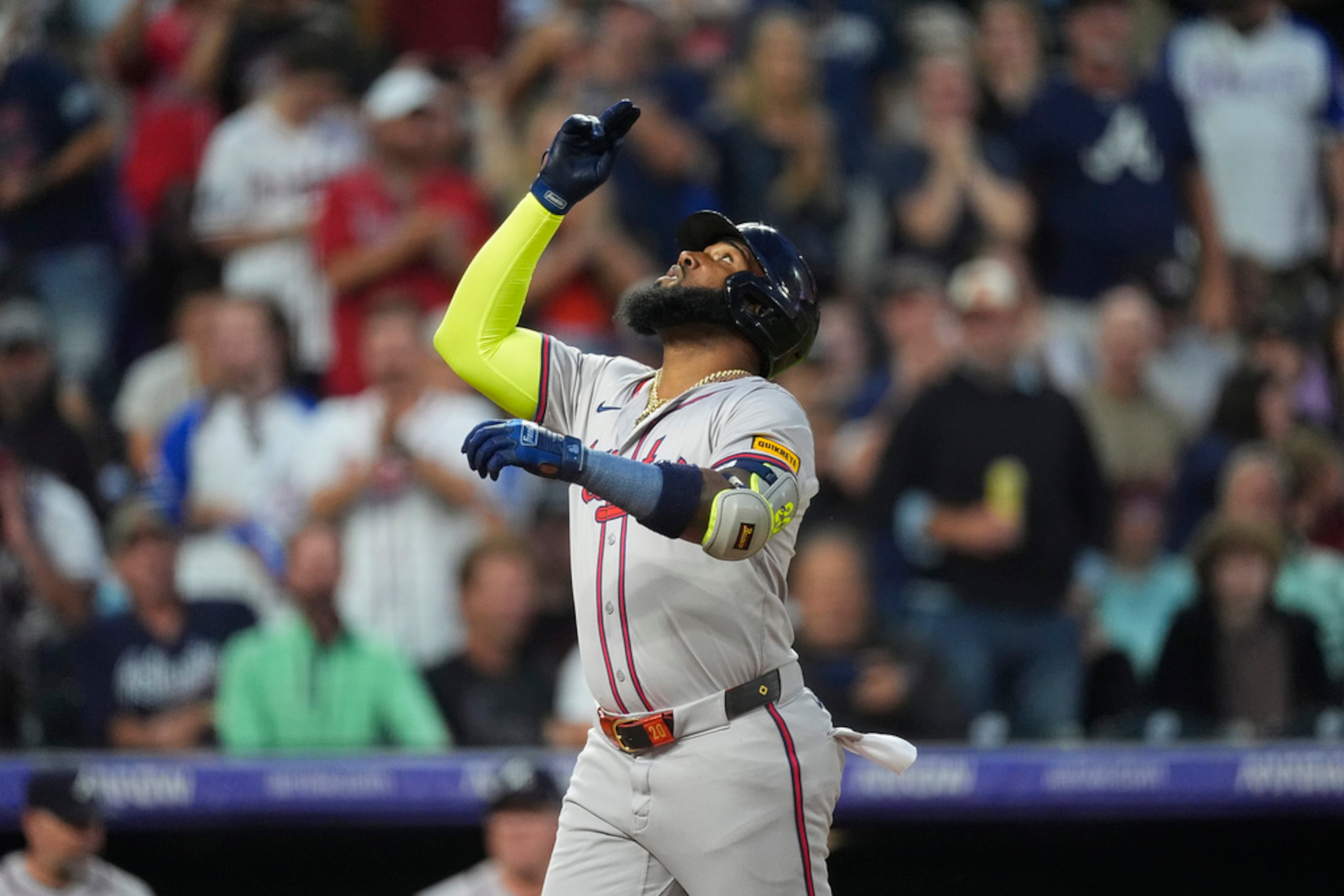 Atlanta Braves' Marcell Ozuna gestures as he crosses home plate after hitting a solo home run off Colorado Rockies relief pitcher Noah Davis in the fifth inning of a baseball game Saturday, Aug. 10, 2024, in Denver. (AP Photo/David Zalubowski)