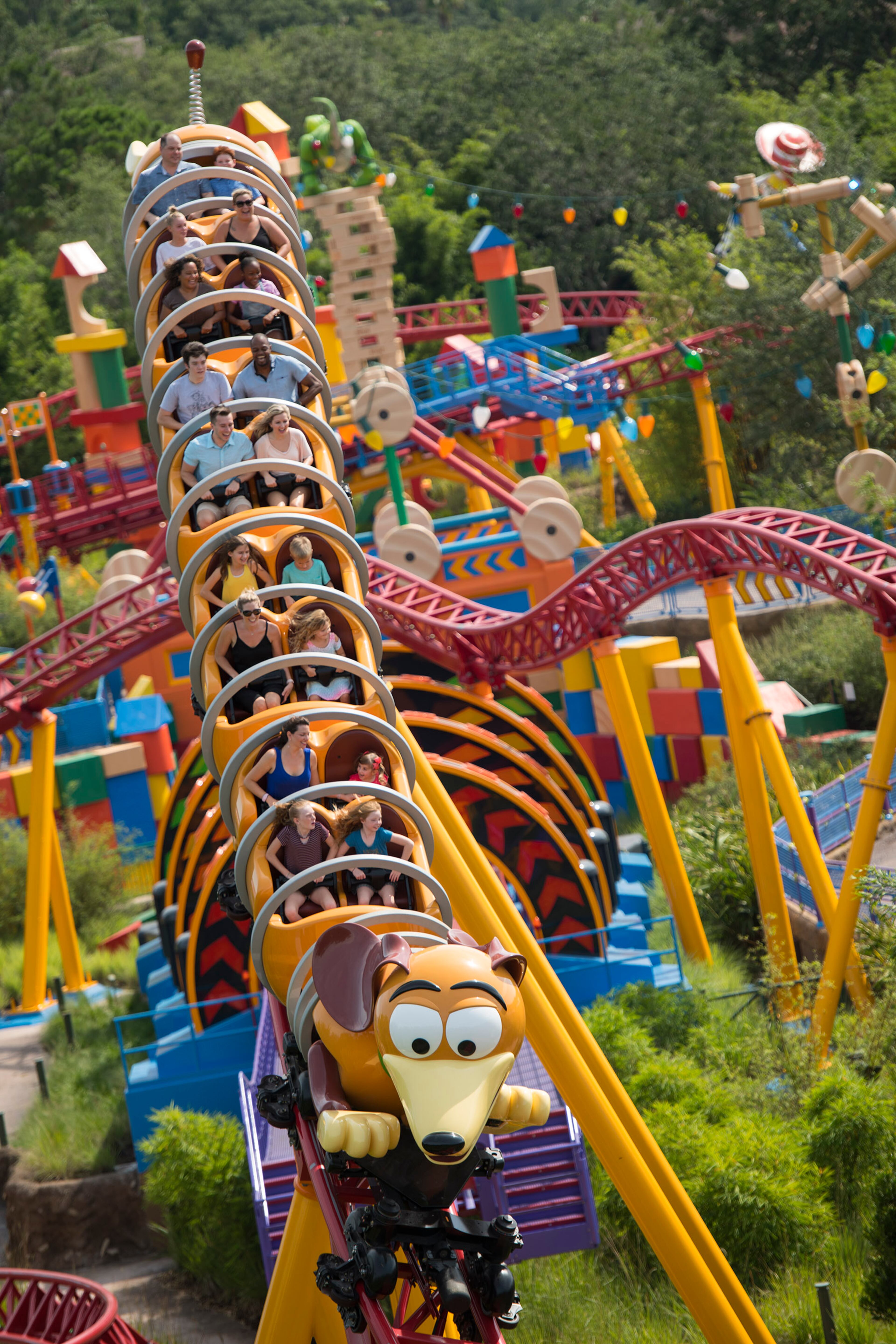 Slinky DogÕs coils twist and turn around the curves, hills, and drops of Slinky Dog Dash at Toy Story Land at DisneyÕs Hollywood Studios. The family-friendly coaster is inspired by the hit Pixar Animation StudiosÕ Toy Story films, and is DisneyÕs first coaster with a double-launch. Walt Disney World Resort guests get to race and dive around a track that stretches across Toy Story Land. (David Roark, photographer)
