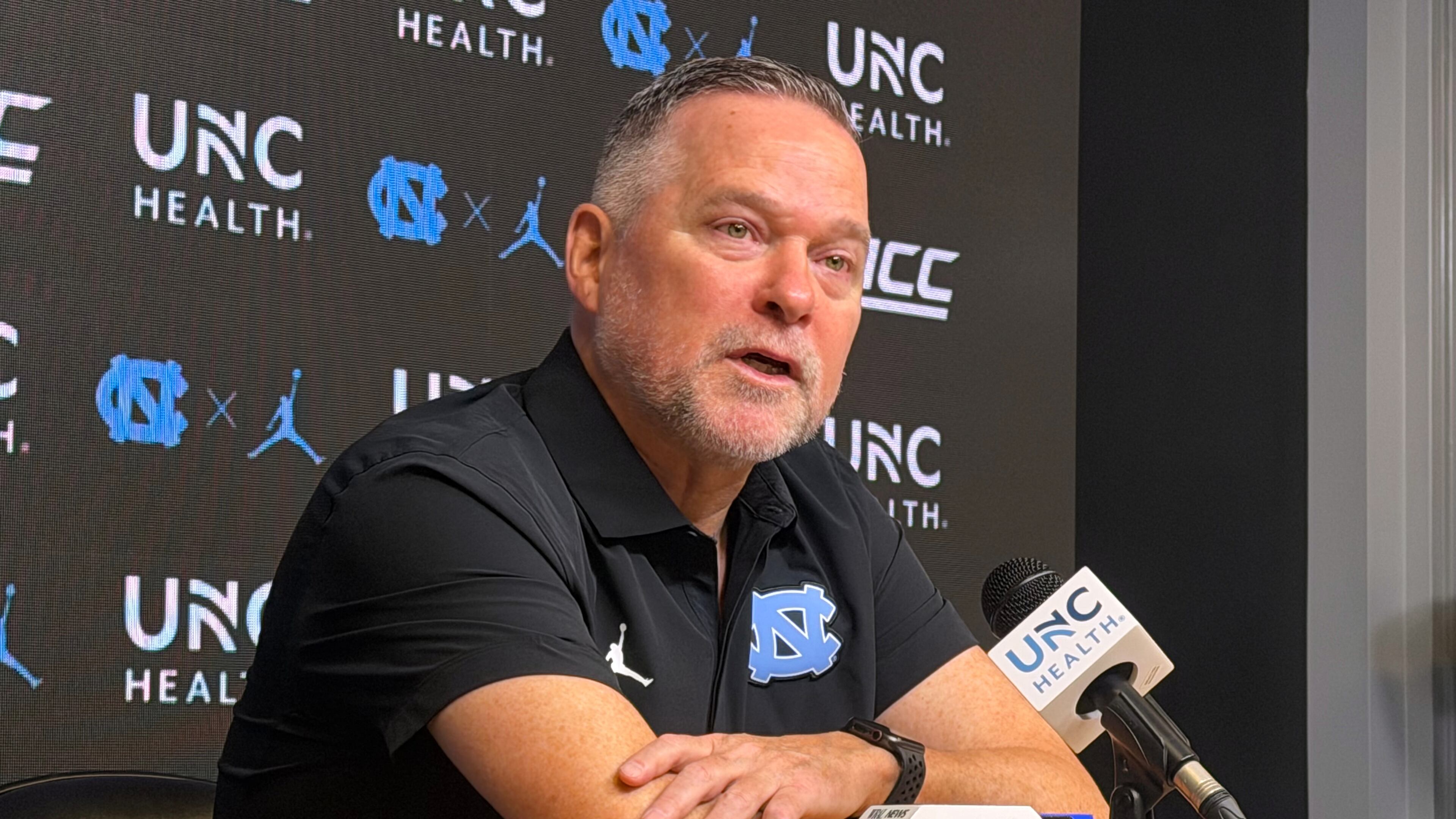 In this photo taken with a smartphone, North Carolina men's basketball head coach Michael Malone speaks during a news conference Thursday, Sept. 3, 2026, in Chapel Hill, N.C. (AP Photo/Aaron Beard)