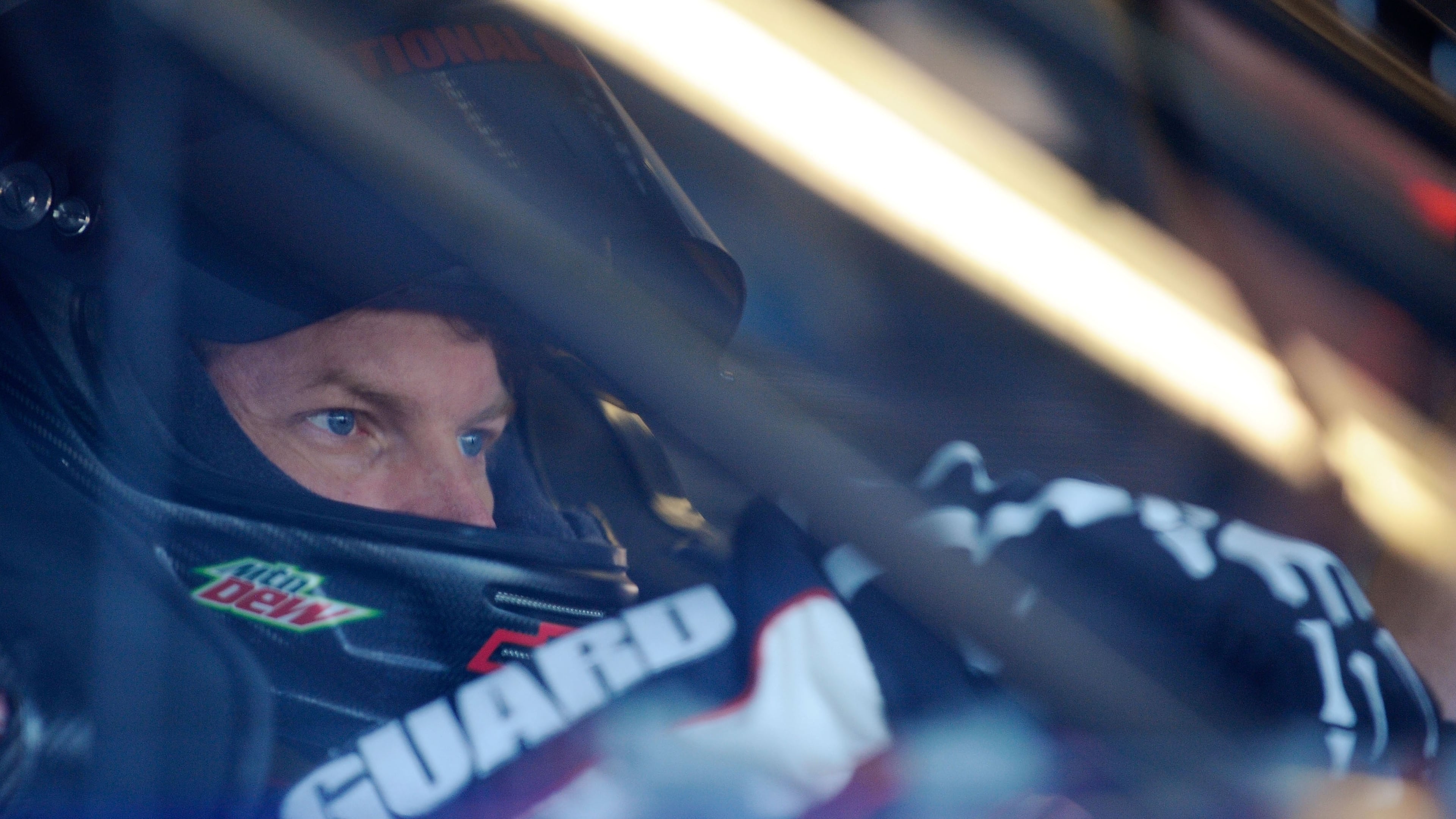 DAYTONA BEACH, FL - FEBRUARY 11: Dale Earnhardt Jr., driver of the #88 National Guard Chevrolet, sits in his car in the garage during practice for the NASCAR Budweiser Shootout at Daytona International Speedway on February 11, 2011 in Daytona Beach, Florida. (Photo by Jared C. Tilton/Getty Images for NASCAR)