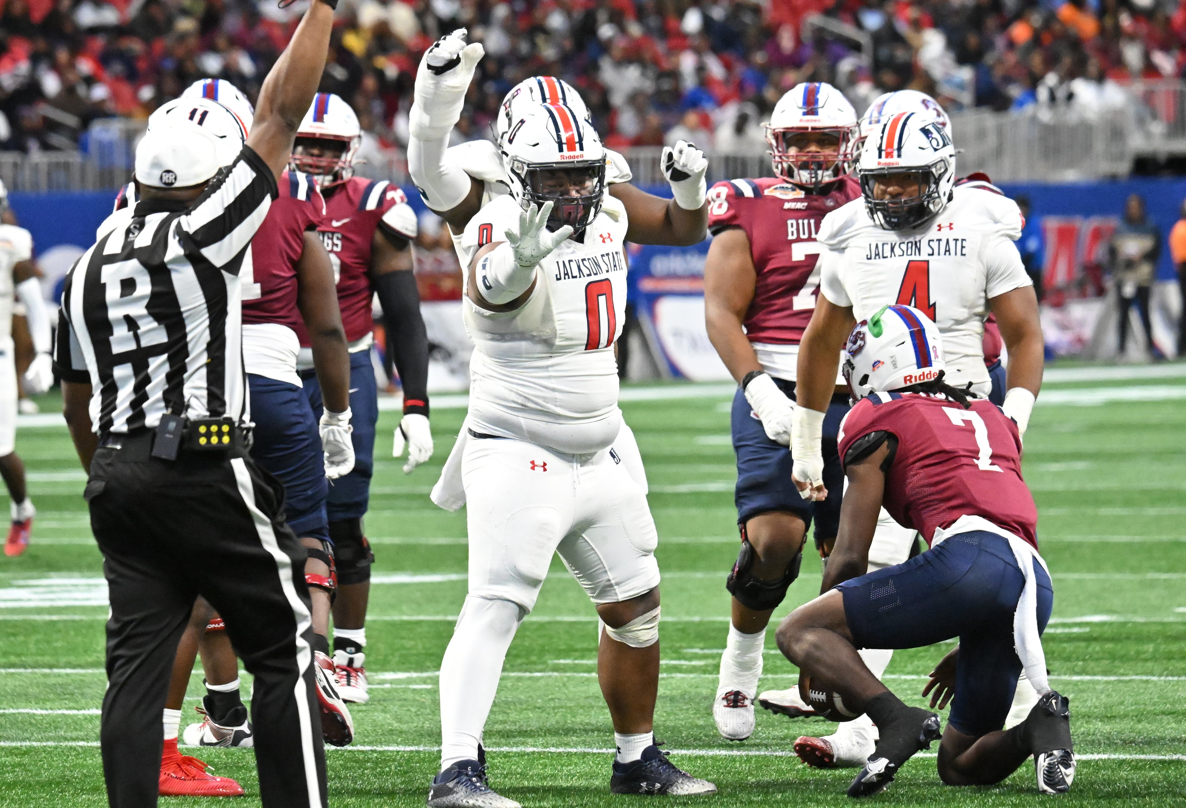 Jackson State defensive lineman Jeremiah Williams (0) reacts after sacking South Carolina State quarterback Eric Phoenix during the second half in 2024 Cricket Celebration Bowl at Mercedes-Benz Stadium, Saturday, December 14, 2024, in Atlanta. Jackson State won 28-7 over South Carolina State. (Hyosub Shin / AJC)