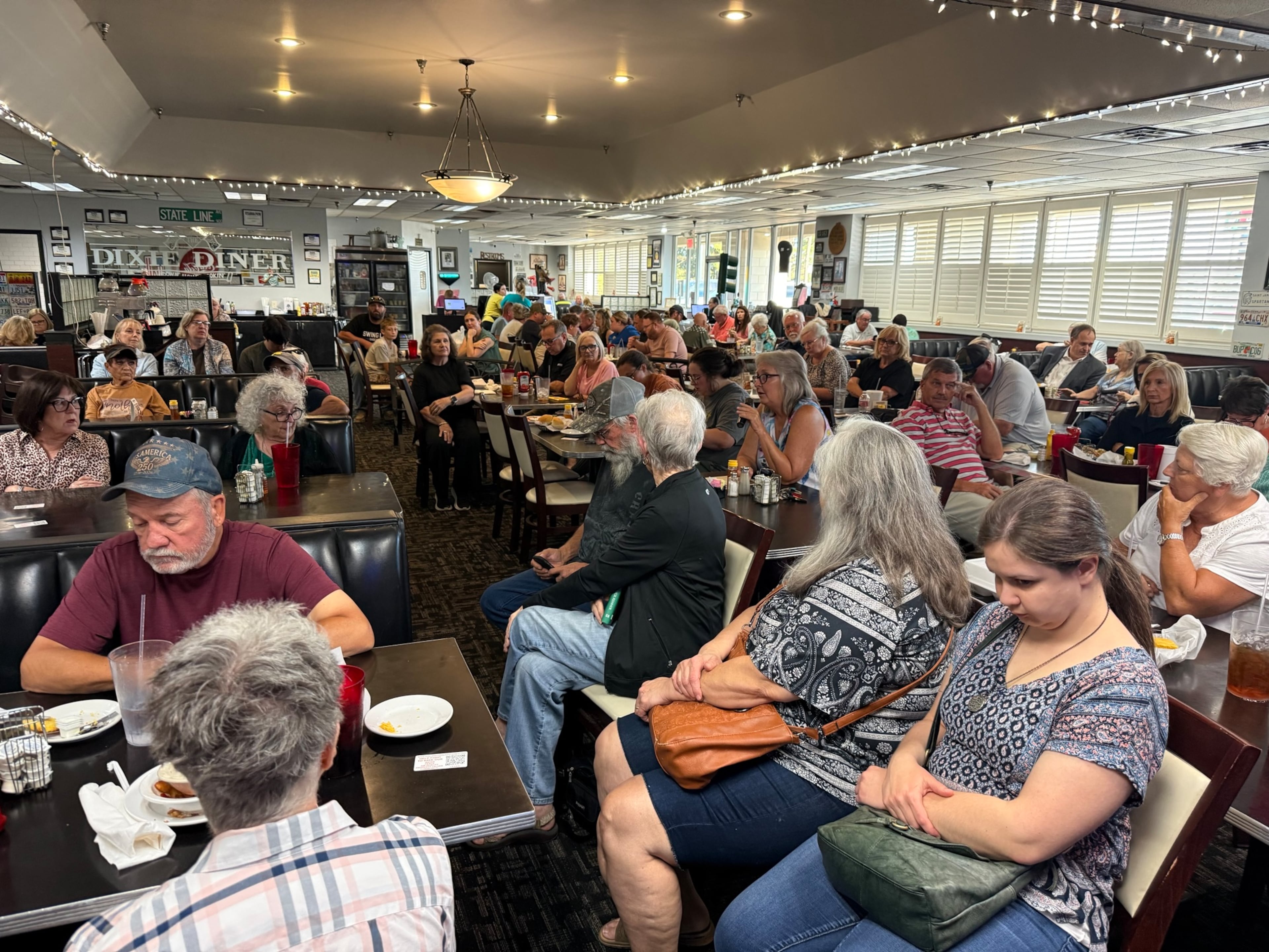 Dozens of data center opponents gathered at the Dixie Diner in Texarkana, Texas, on Thursday. A proposed nearby project by a firm linked to Republican nominee for Georgia governor Rick Jackson is at the center of their frustration. (Greg Bluestein/AJC)
